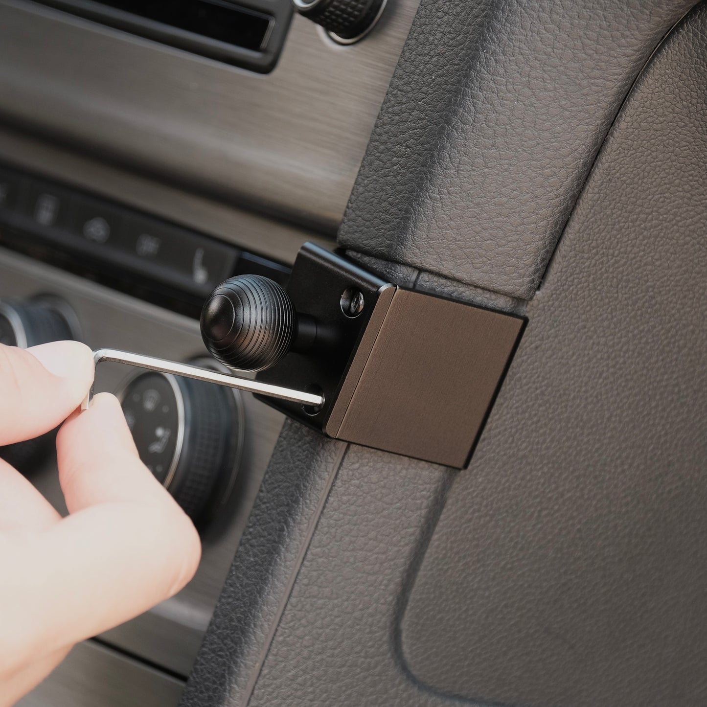 Image of Offroam Mounting Base installed securely in Volkswagen Golf 2015-2021. This premium all metal phone mounting base installs easily without drilling or glue. Perfect placement without blocking screens, driver view, or air flow.