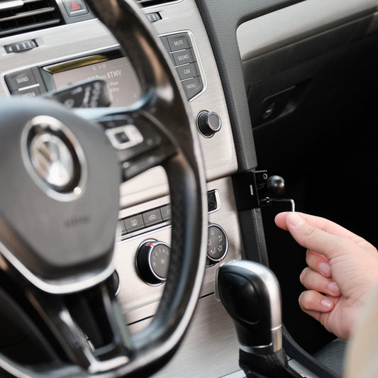 Image of Offroam Mounting Base installed securely in Volkswagen Golf 2015-2021. This premium all metal phone mounting base installs easily without drilling or glue. Perfect placement without blocking screens, driver view, or air flow.