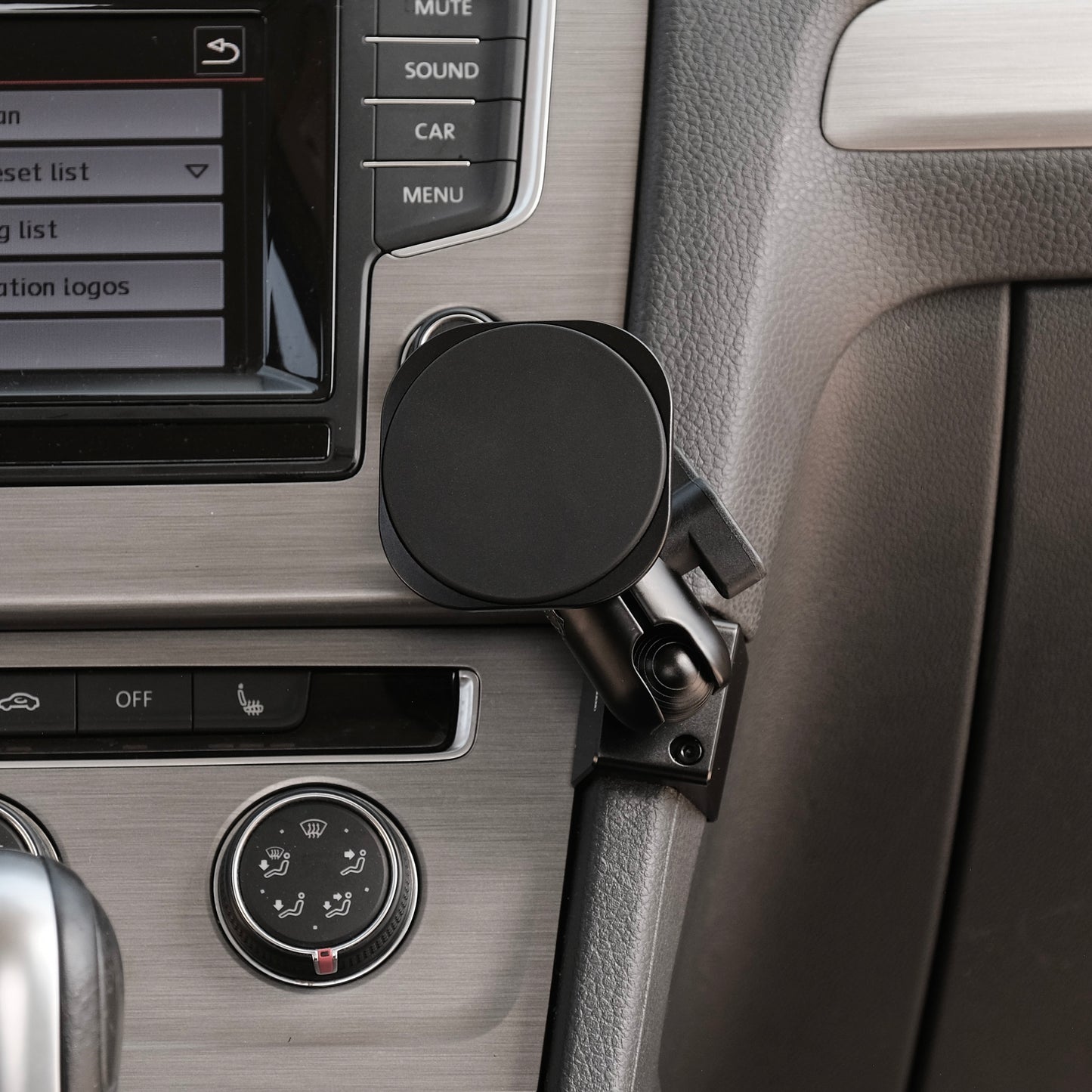 Image of Offroam MagSafe-compatible Phone Mount installed securely in Volkswagen Golf 2015-2021. This premium phone mount installs easily without drilling or glue. High force magnets hold phone on any trail, road, or track. Perfect placement without blocking screens, driver view, or air flow. Fully adjustable positioning.