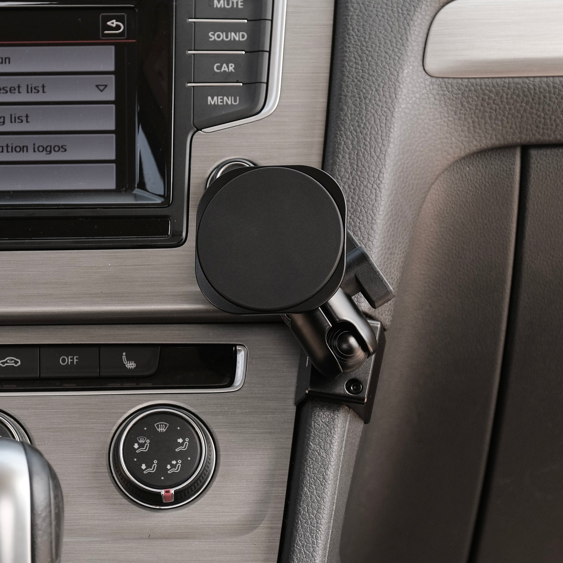 Image of Offroam MagSafe-compatible Phone Mount installed securely in Volkswagen Golf 2015-2021. This premium phone mount installs easily without drilling or glue. High force magnets hold phone on any trail, road, or track. Perfect placement without blocking screens, driver view, or air flow. Fully adjustable positioning.