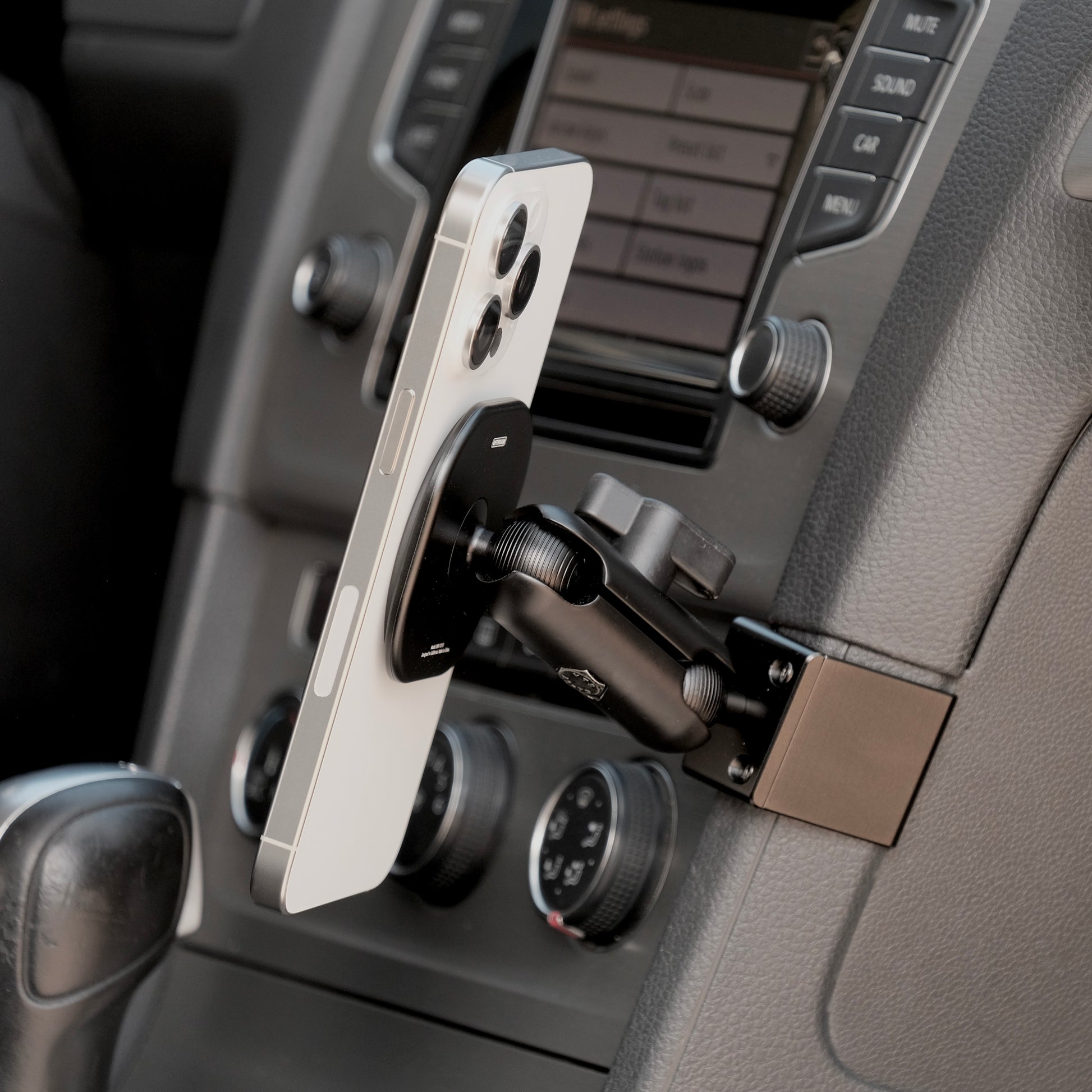 Image of Offroam MagSafe-compatible Phone Mount installed securely in Volkswagen Golf 2015-2021. This premium phone mount installs easily without drilling or glue. High force magnets hold phone on any trail, road, or track. Perfect placement without blocking screens, driver view, or air flow. Fully adjustable positioning.