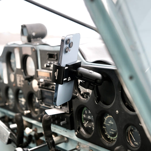 Image of Offroam Phone Mount for all General Aviation (GA) aircraft with inoperable instrument availability. This premium phone mount installs easily without drilling or glue. Spring loaded Universal holder for use with any phone. Perfect placement without blocking glass, analog gauges, or cockpit view. Fully adjustable positioning.