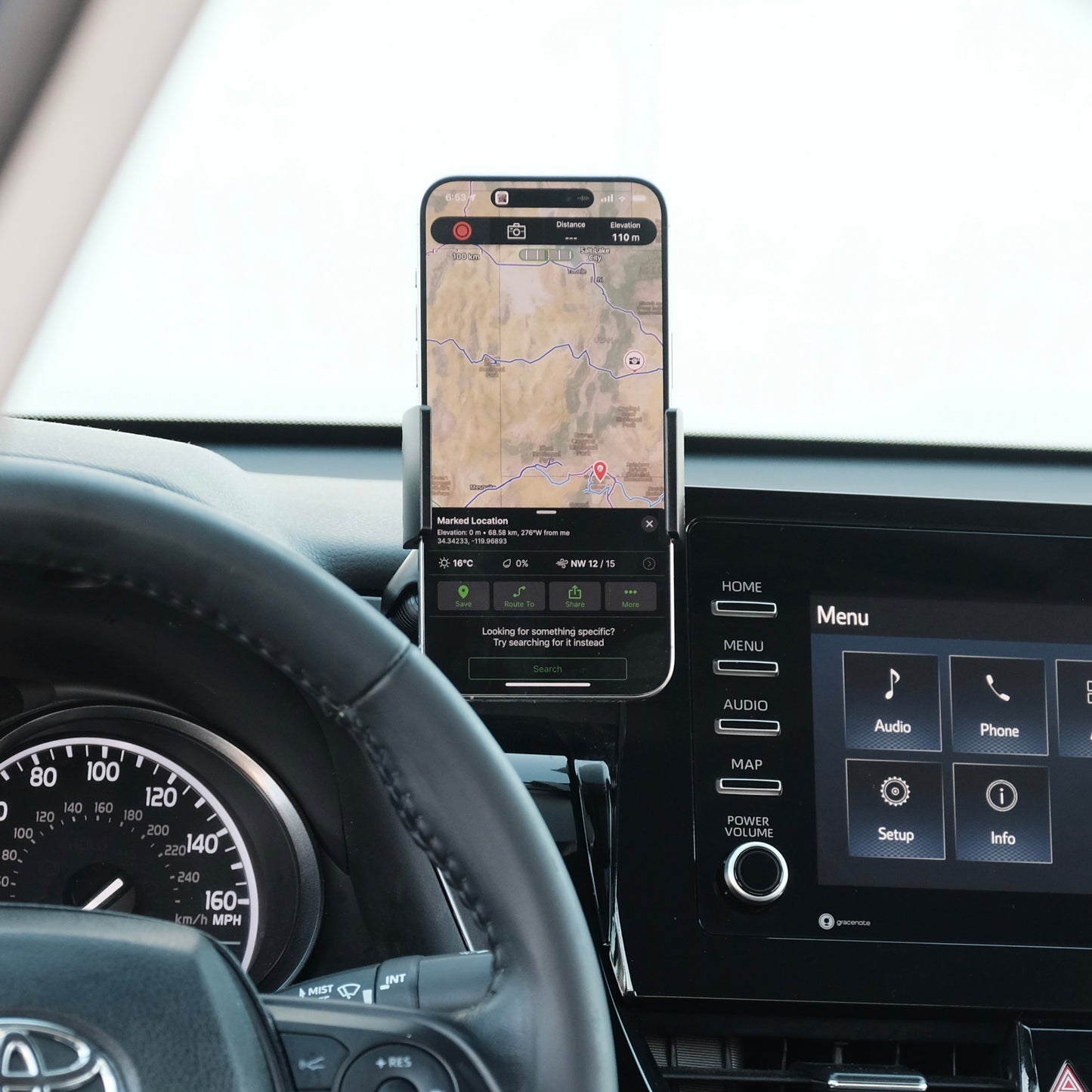 Image of Offroam Phone Mount installed securely in Toyota Camry 2021-2024. This premium phone mount installs easily without drilling or glue. Spring loaded Universal holder for use with any phone. Perfect placement without blocking screens, driver view, or air flow. Fully adjustable positioning.