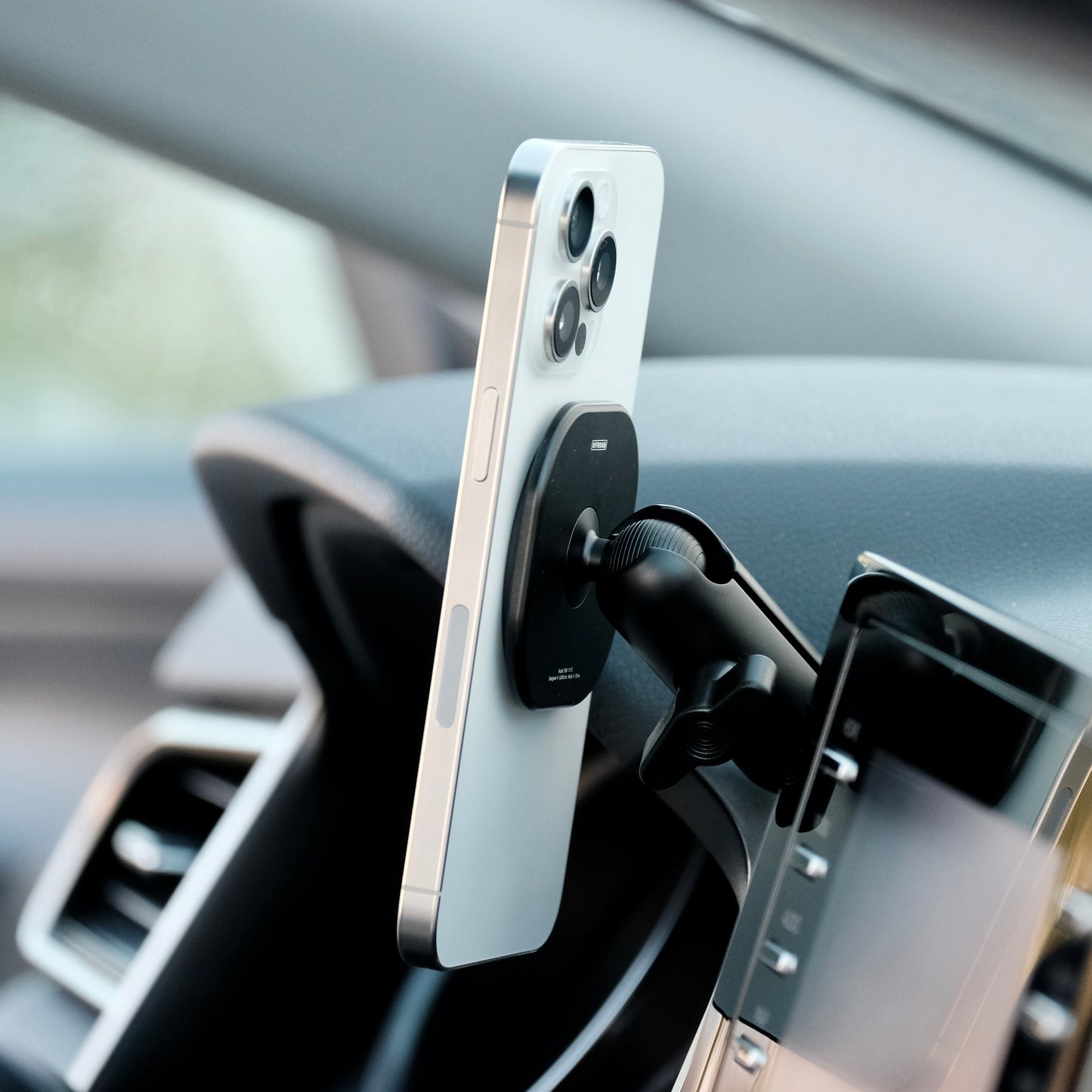 Image of Offroam MagSafe-compatible Phone Mount installed securely in Toyota Camry 2021-2024. This premium phone mount installs easily without drilling or glue. High force magnets hold phone on any trail, road, or track. Perfect placement without blocking screens, driver view, or air flow. Fully adjustable positioning.