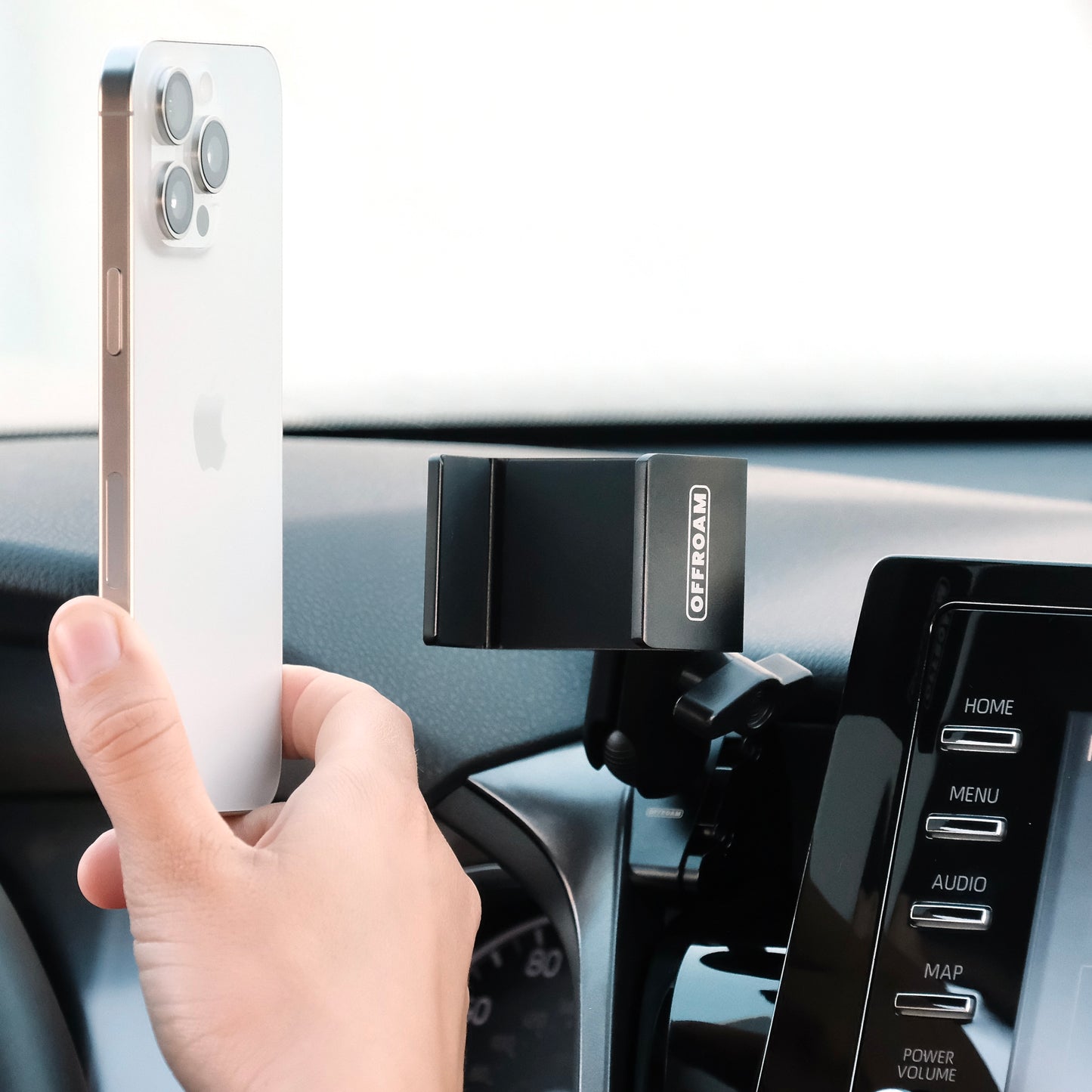 Image of Offroam Phone Mount installed securely in Toyota Camry 2021-2024. This premium phone mount installs easily without drilling or glue. Spring loaded Universal holder for use with any phone. Perfect placement without blocking screens, driver view, or air flow. Fully adjustable positioning.