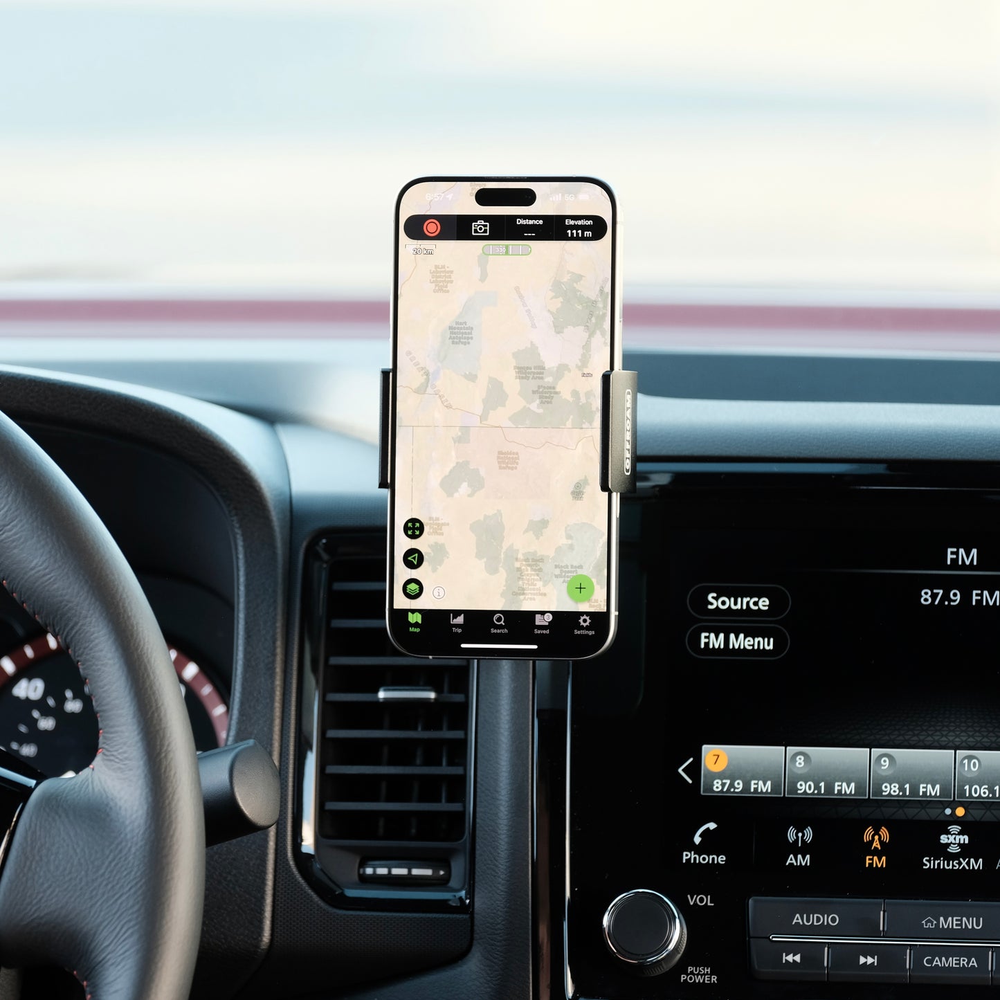 Image of Offroam Phone Mount installed securely in Nissan Frontier 2022-2024. This premium phone mount installs easily without drilling or glue. Spring loaded Universal holder for use with any phone. Perfect placement without blocking screens, driver view, or air flow. Fully adjustable positioning.