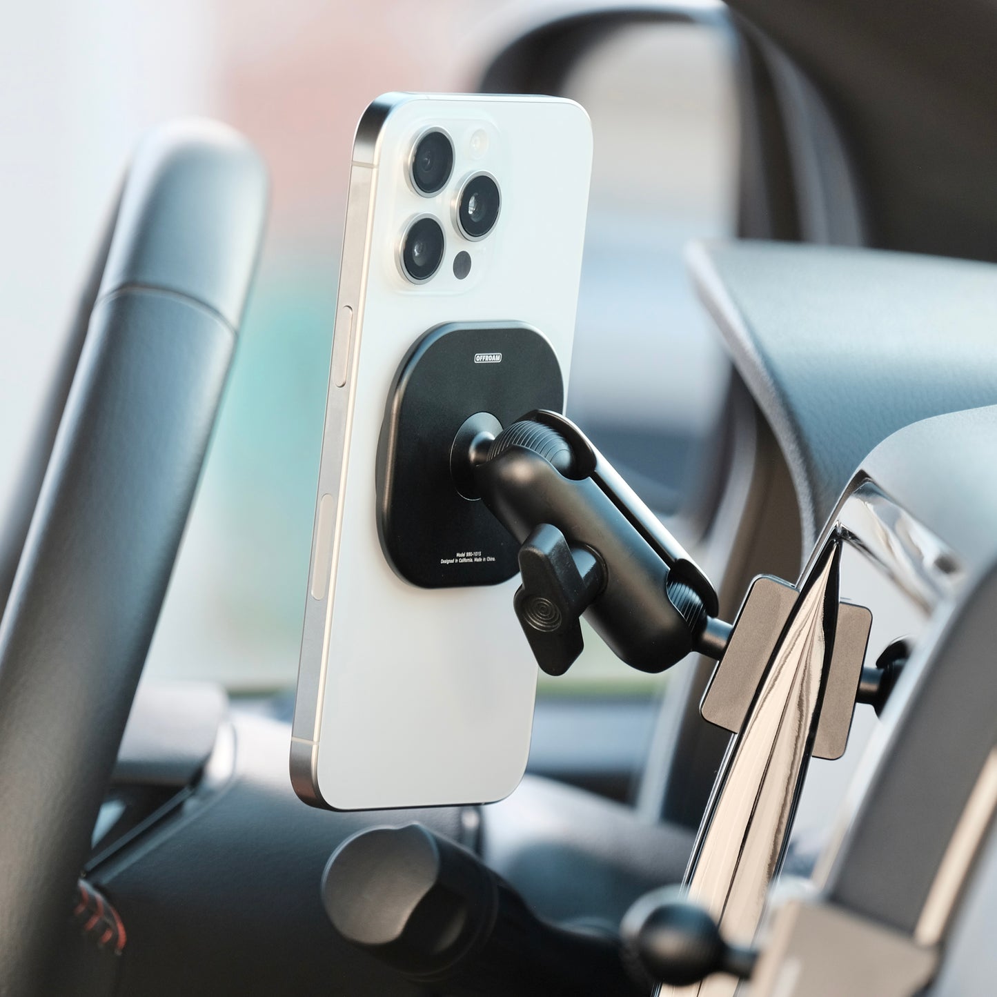 Image of Offroam MagSafe-compatible Phone Mount installed securely in Nissan Frontier 2022-2024. This premium phone mount installs easily without drilling or glue. High force magnets hold phone on any trail, road, or track. Perfect placement without blocking screens, driver view, or air flow. Fully adjustable positioning.