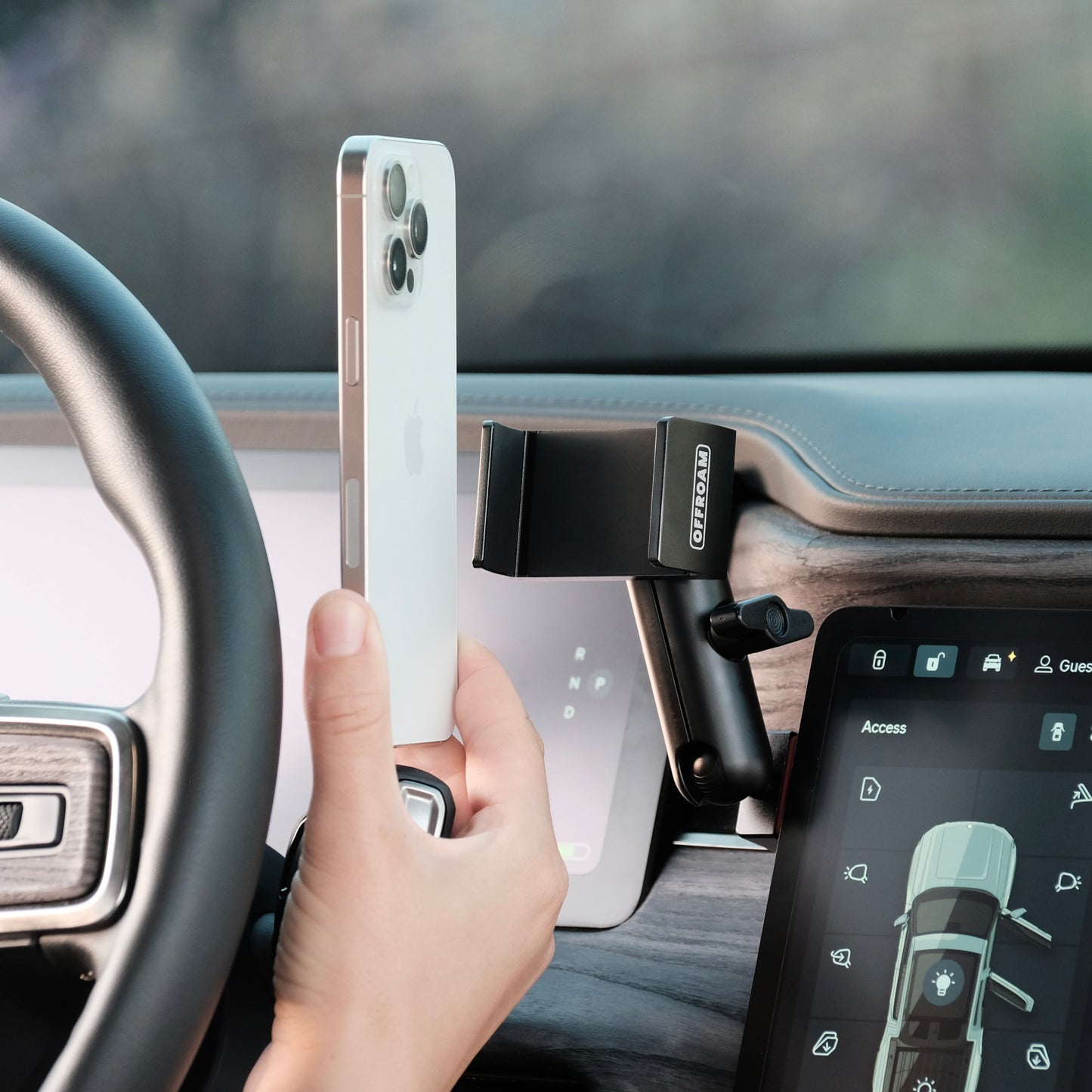 Image of Offroam Phone Mount installed securely in Rivian R1T | R1S 2022-2025. This premium phone mount installs easily without drilling or glue. Spring loaded Universal holder for use with any phone. Perfect placement without blocking screens, driver view, or air flow. Fully adjustable positioning.