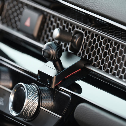 Image of Offroam Mounting Base installed securely in Honda Civic 2022-2026 | CR-V 2023-2026. This premium all metal phone mounting base installs easily without drilling or glue. Perfect placement without blocking screens, driver view, or air flow.