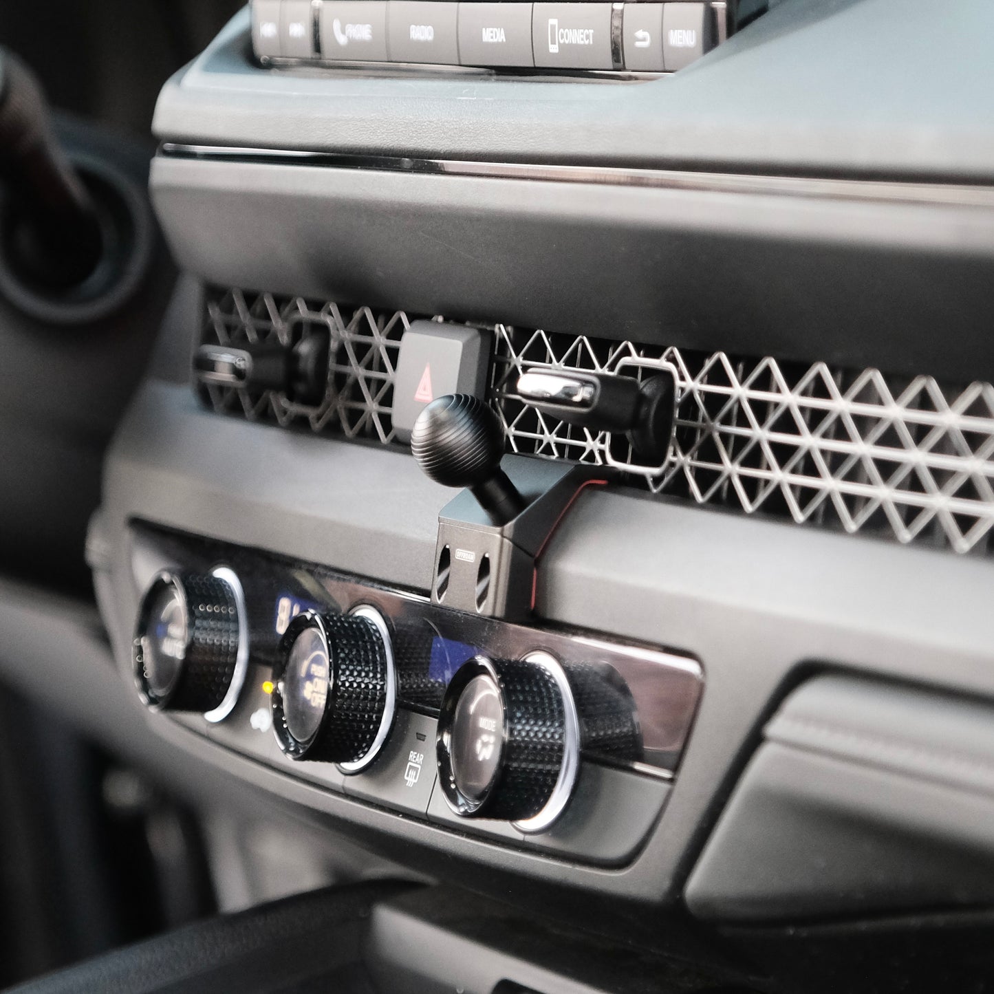 Image of Offroam Mounting Base installed securely in Honda Accord 2023-2025. This premium all metal phone mounting base installs easily without drilling or glue. Perfect placement without blocking screens, driver view, or air flow.