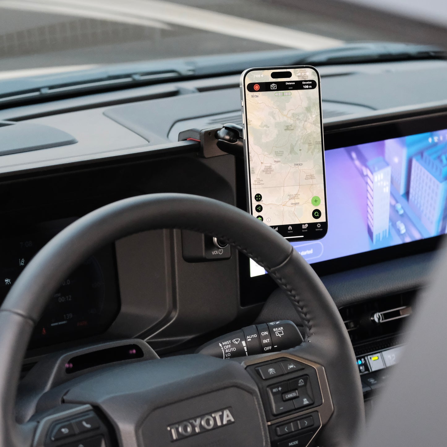 Image of Offroam MagSafe-compatible Phone Mount installed securely in Toyota Land Cruiser 250 2024-2026. This premium phone mount installs easily without drilling or glue. High force magnets hold phone on any trail, road, or track. Perfect placement without blocking screens, driver view, or air flow. Fully adjustable positioning.