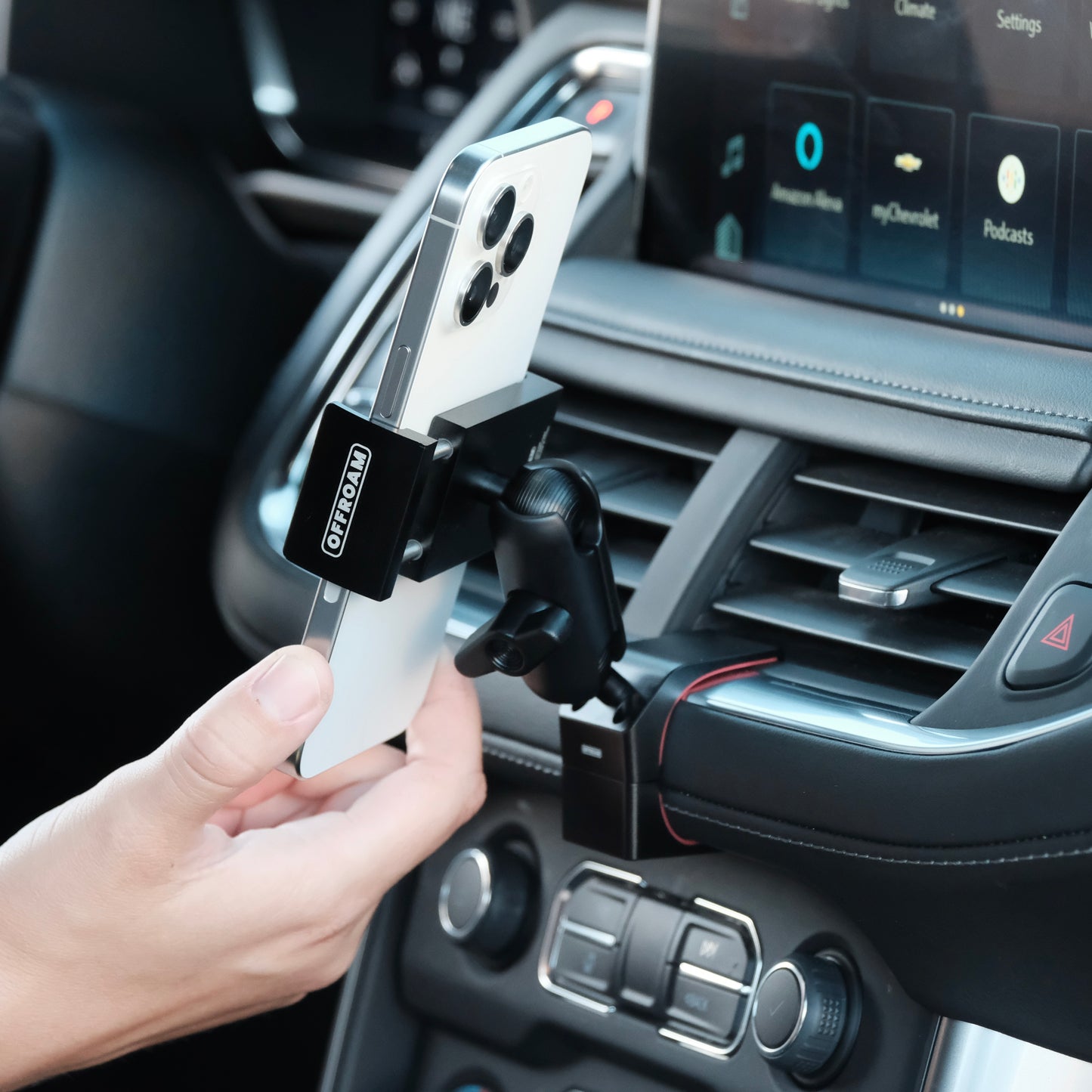 Image of Offroam Phone Mount installed securely in Chevrolet Suburban | Tahoe & GMC Yukon | Yukon XL 2021-2024. This premium phone mount installs easily without drilling or glue. Spring loaded Universal holder for use with any phone. Perfect placement without blocking screens, driver view, or air flow. Fully adjustable positioning.