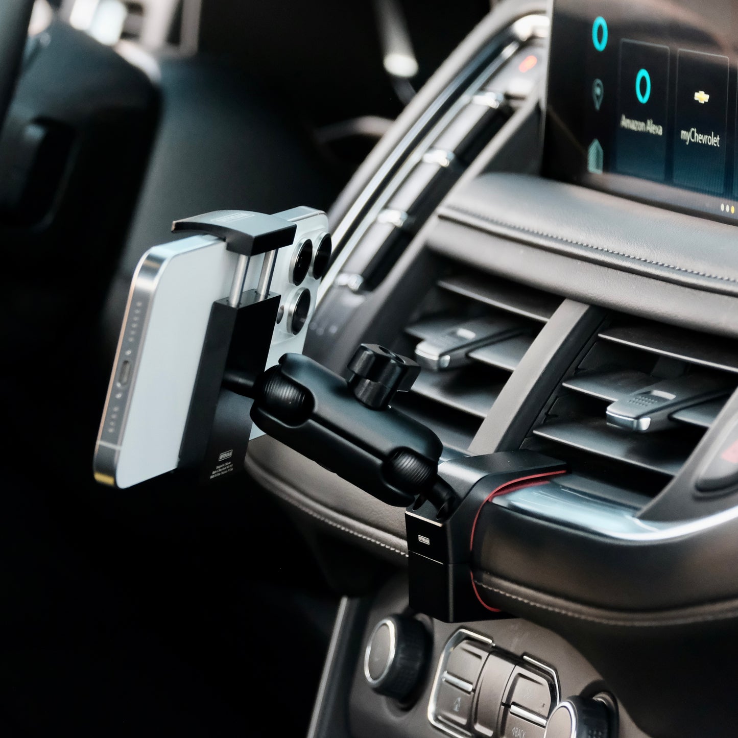 Image of Offroam Phone Mount installed securely in Chevrolet Suburban | Tahoe & GMC Yukon | Yukon XL 2021-2024. This premium phone mount installs easily without drilling or glue. Spring loaded Universal holder for use with any phone. Perfect placement without blocking screens, driver view, or air flow. Fully adjustable positioning.