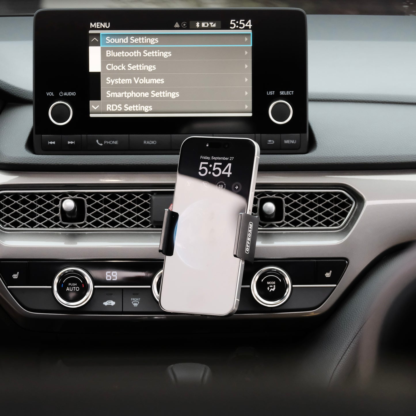 Image of Offroam Phone Mount installed securely in Acura Integra 2023-2025. This premium phone mount installs easily without drilling or glue. Spring loaded Universal holder for use with any phone. Perfect placement without blocking screens, driver view, or air flow. Fully adjustable positioning.