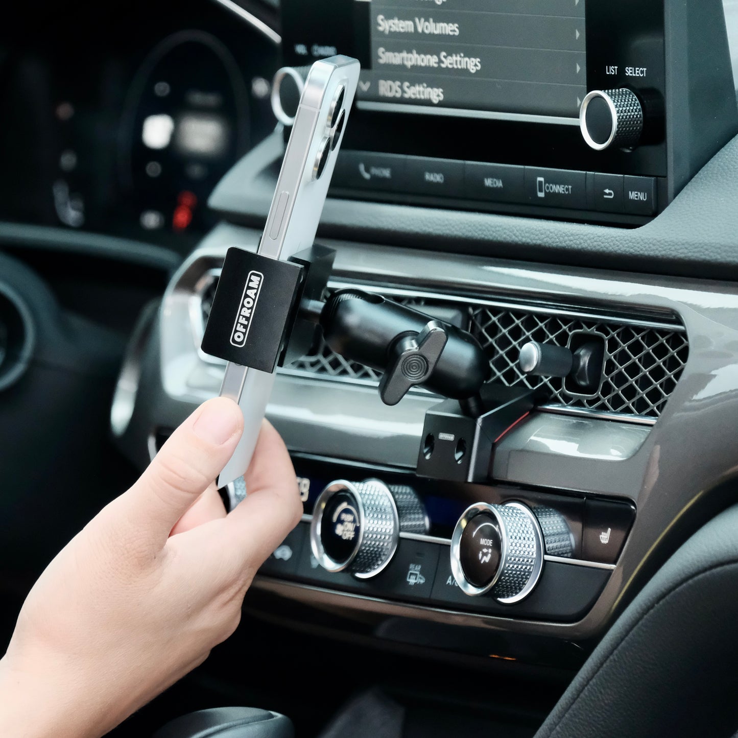 Image of Offroam Phone Mount installed securely in Acura Integra 2023-2025. This premium phone mount installs easily without drilling or glue. Spring loaded Universal holder for use with any phone. Perfect placement without blocking screens, driver view, or air flow. Fully adjustable positioning.