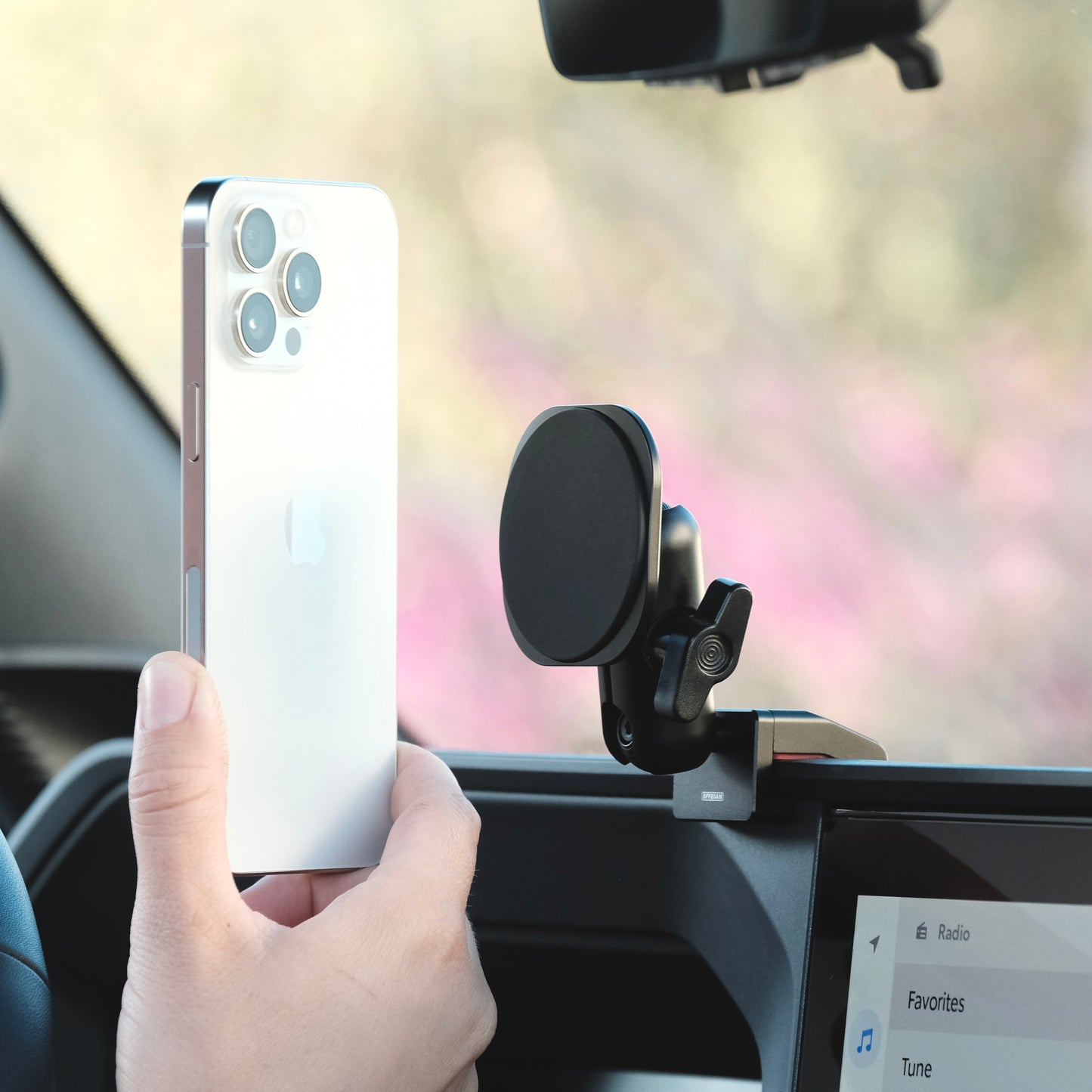 Image of Offroam MagSafe-compatible Phone Mount installed securely in Toyota Land Cruiser 250 2024-2026. This premium phone mount installs easily without drilling or glue. High force magnets hold phone on any trail, road, or track. Perfect placement without blocking screens, driver view, or air flow. Fully adjustable positioning.