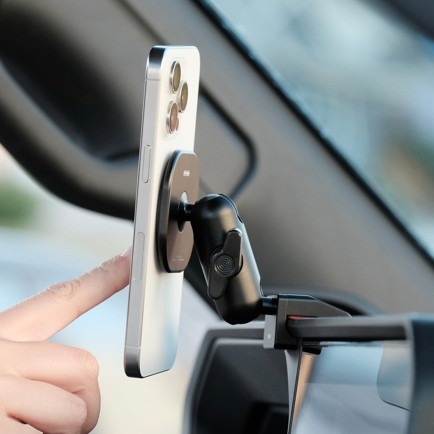 Image of Offroam MagSafe-compatible Phone Mount installed securely in Toyota Land Cruiser 250 2024-2026. This premium phone mount installs easily without drilling or glue. High force magnets hold phone on any trail, road, or track. Perfect placement without blocking screens, driver view, or air flow. Fully adjustable positioning.
