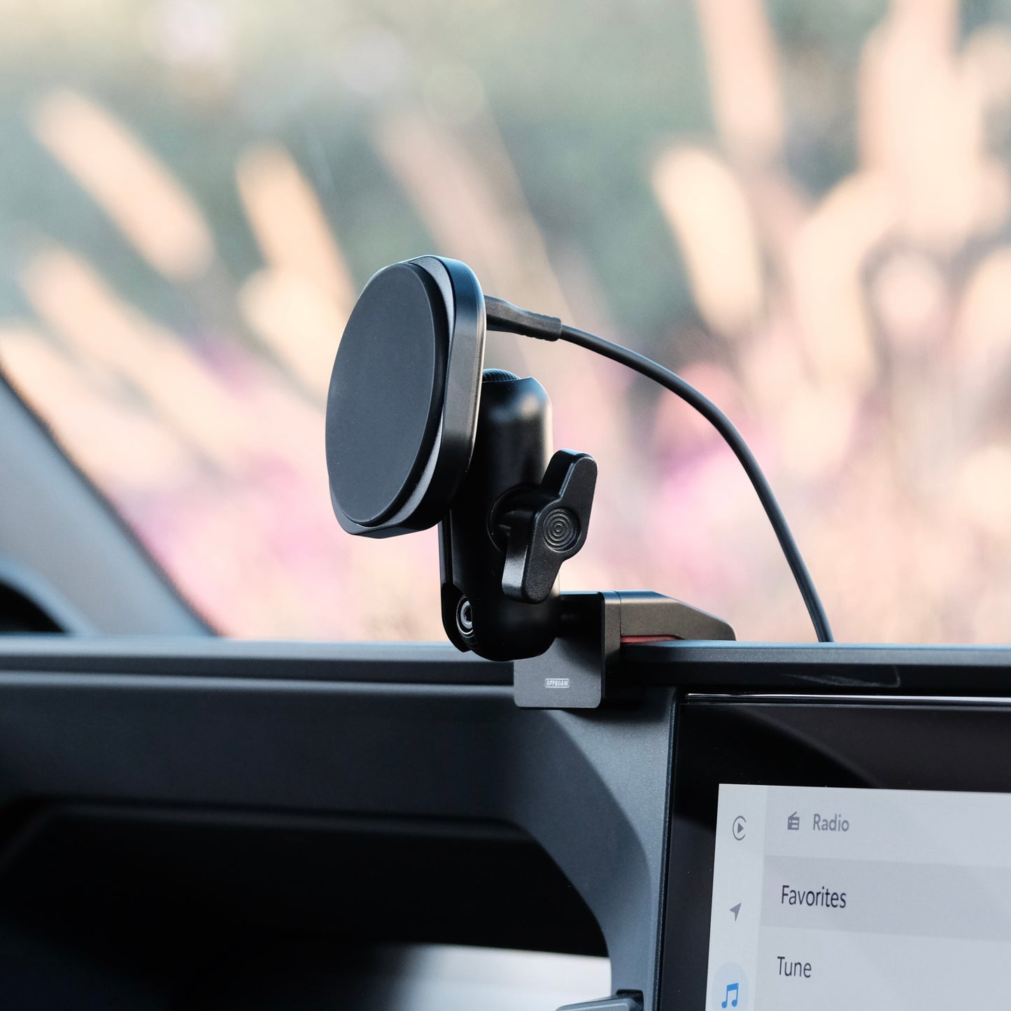 Image of Offroam MagSafe-compatible Phone Mount installed securely in Toyota Land Cruiser 250 2024-2026. This premium phone mount installs easily without drilling or glue. High force magnets hold phone on any trail, road, or track. Perfect placement without blocking screens, driver view, or air flow. Fully adjustable positioning.