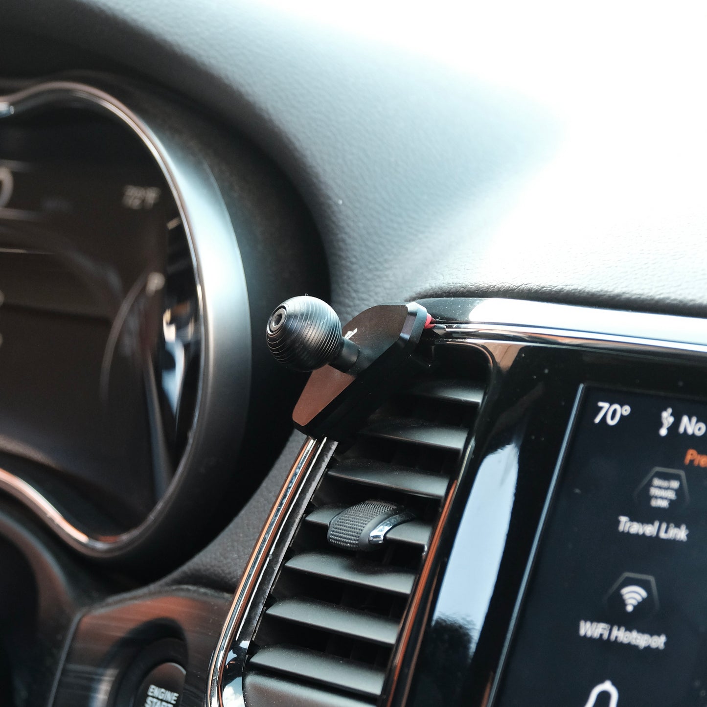 Image of Offroam Mounting Base installed securely in Jeep Grand Cherokee WK2 2014-2022. This premium all metal phone mounting base installs easily without drilling or glue. Perfect placement without blocking screens, driver view, or air flow.