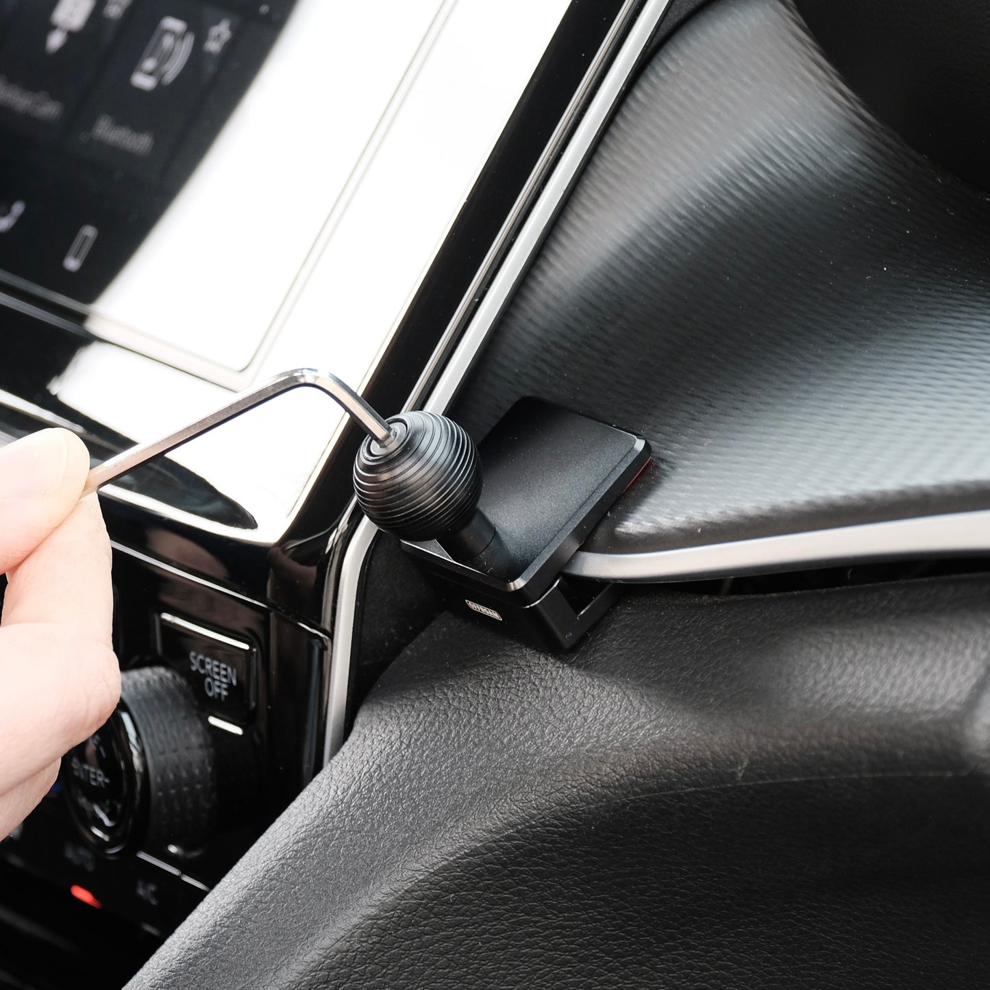 Image of Offroam Mounting Base installed securely in Toyota 4Runner 2010-2024 & Jeep Grand Cherokee 2022-2026. This premium all metal phone mounting base installs easily without drilling or glue. Perfect placement without blocking screens, driver view, or air flow.