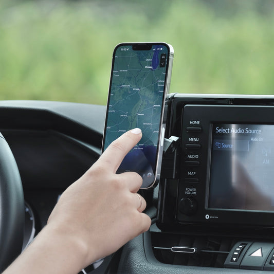 Image of Offroam MagSafe-compatible Phone Mount installed securely in Toyota RAV4 2019-2025 with 7-in. or 8-in. Toyota Audio Multimedia. This premium phone mount installs easily without drilling or glue. High force magnets hold phone on any trail, road, or track. Perfect placement without blocking screens, driver view, or air flow. Fully adjustable positioning.