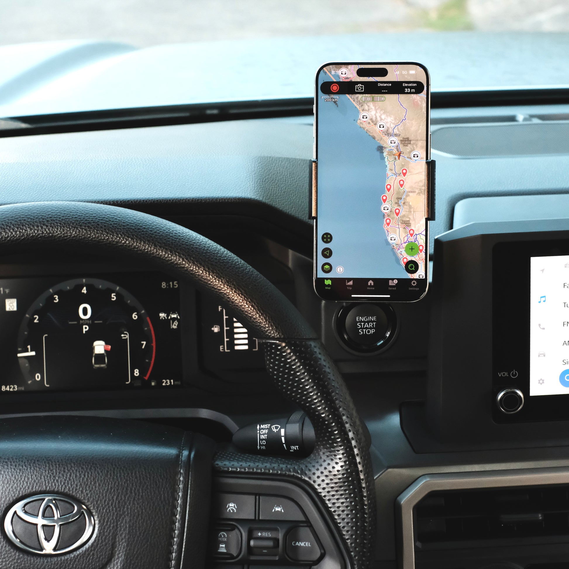 Image of Offroam Phone Mount installed securely in Toyota Tacoma 2024-2025 | 4Runner 2025. This premium phone mount installs easily without drilling or glue. Spring loaded Universal holder for use with any phone. Perfect placement without blocking screens, driver view, or air flow. Fully adjustable positioning.