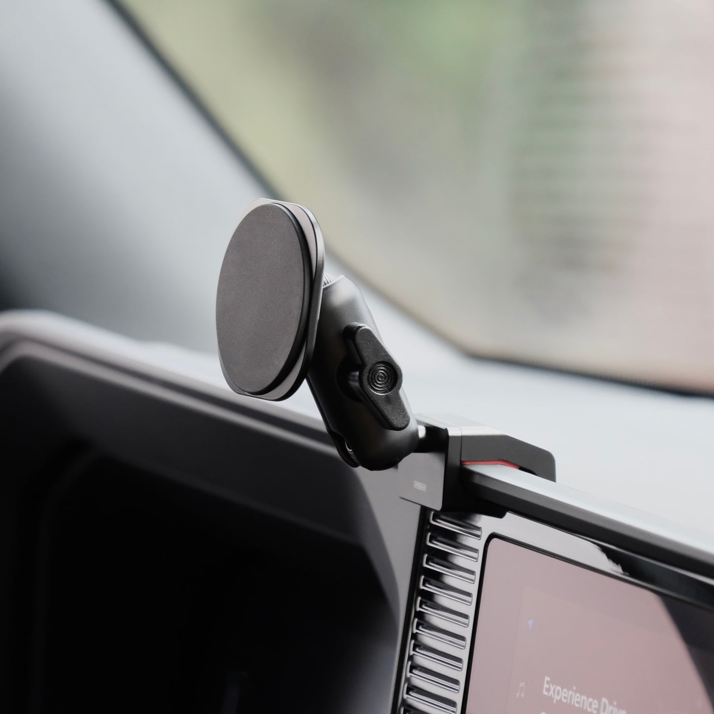 Image of Offroam MagSafe-compatible Phone Mount installed securely in Toyota Land Cruiser 250 2024-2026. This premium phone mount installs easily without drilling or glue. High force magnets hold phone on any trail, road, or track. Perfect placement without blocking screens, driver view, or air flow. Fully adjustable positioning.