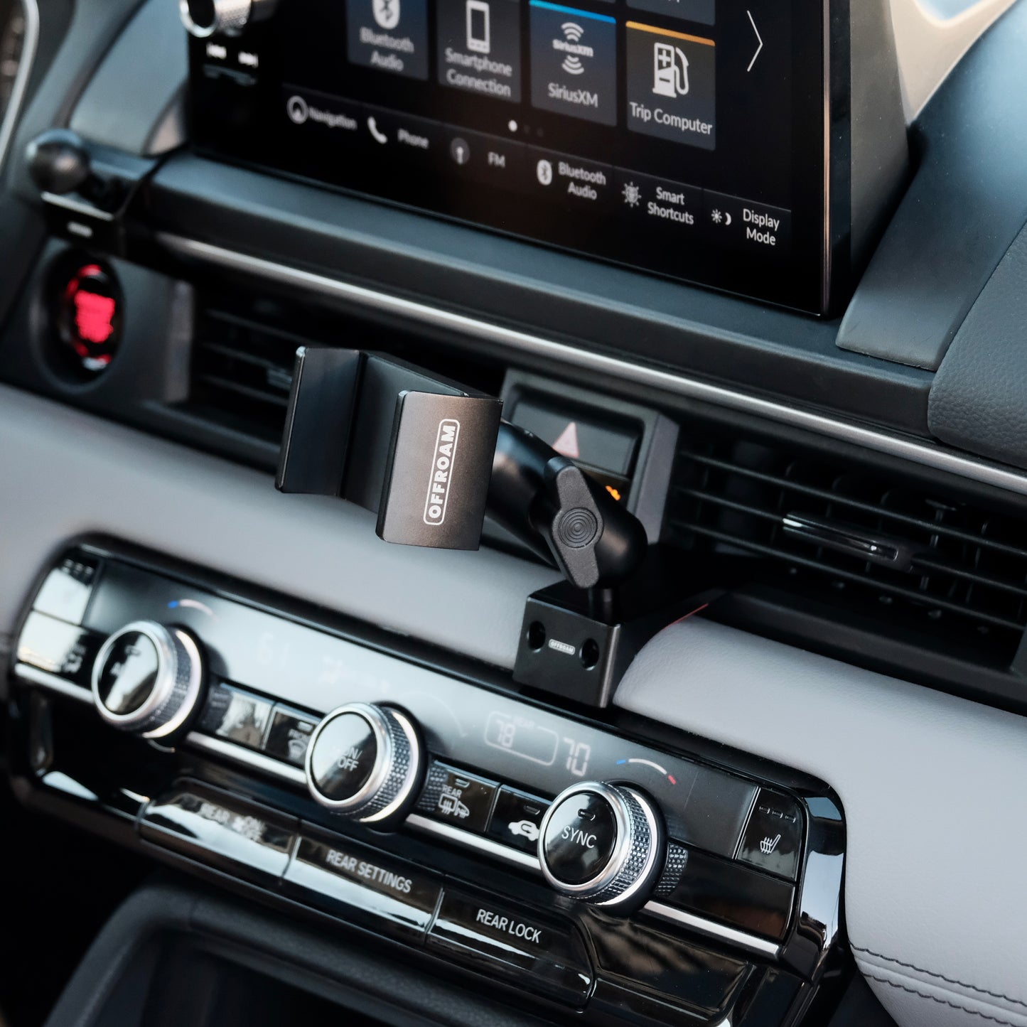 Image of Offroam Phone Mount installed securely in Honda Pilot 2023-2025 | Passport 2026. This premium phone mount installs easily without drilling or glue. Spring loaded Universal holder for use with any phone. Perfect placement without blocking screens, driver view, or air flow. Fully adjustable positioning.