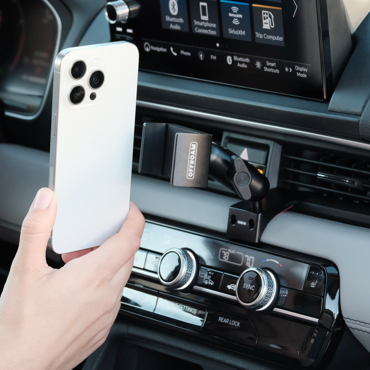 Image of Offroam Phone Mount installed securely in Honda Pilot 2023-2025 | Passport 2026. This premium phone mount installs easily without drilling or glue. Spring loaded Universal holder for use with any phone. Perfect placement without blocking screens, driver view, or air flow. Fully adjustable positioning.