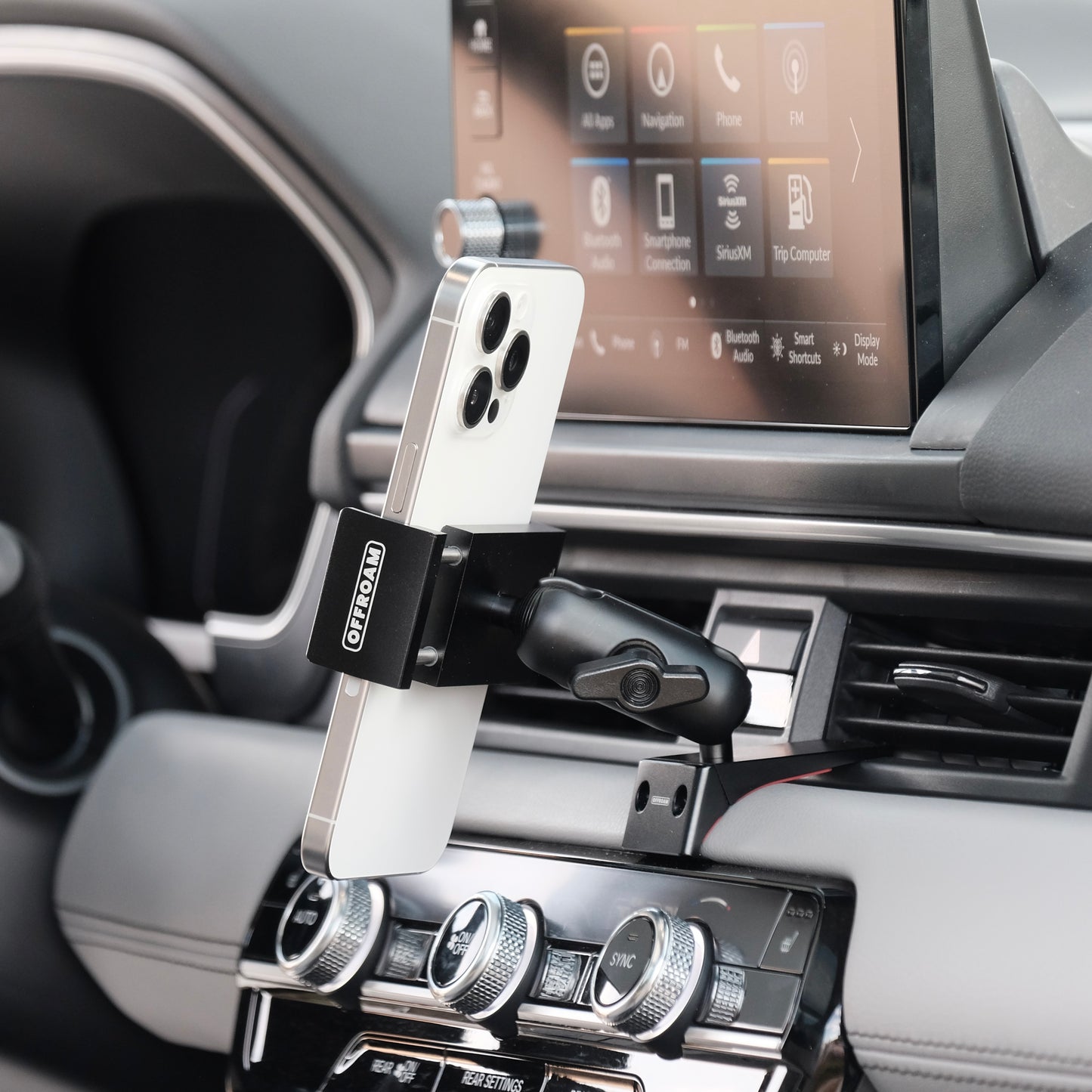 Image of Offroam Phone Mount installed securely in Honda Pilot 2023-2025 | Passport 2026. This premium phone mount installs easily without drilling or glue. Spring loaded Universal holder for use with any phone. Perfect placement without blocking screens, driver view, or air flow. Fully adjustable positioning.