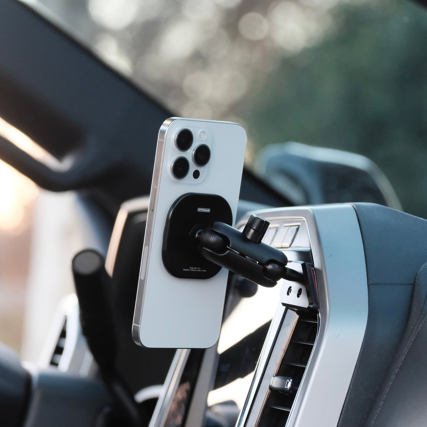 Image of Offroam MagSafe-compatible Phone Mount installed securely in Ford Super Duty 2022 (12in. SYNC4 Touchscreen). This premium phone mount installs easily without drilling or glue. High force magnets hold phone on any trail, road, or track. Perfect placement without blocking screens, driver view, or air flow. Fully adjustable positioning.