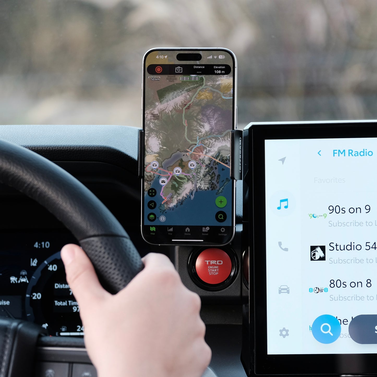 Image of Offroam Phone Mount installed securely in Toyota Tacoma 2024-2025 | 4Runner 2025. This premium phone mount installs easily without drilling or glue. Spring loaded Universal holder for use with any phone. Perfect placement without blocking screens, driver view, or air flow. Fully adjustable positioning.