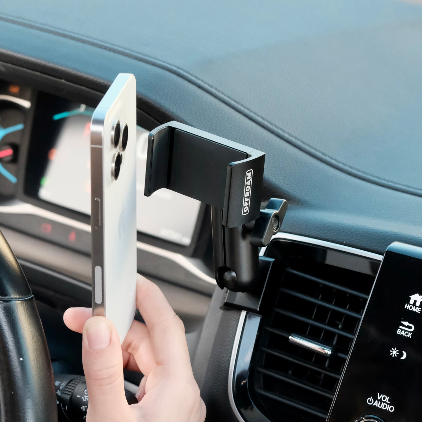 Image of Offroam Phone Mount installed securely in Honda Ridgeline 2016-2025 | Passport 2019-2025 | Pilot 2016-2022. This premium phone mount installs easily without drilling or glue. Spring loaded Universal holder for use with any phone. Perfect placement without blocking screens, driver view, or air flow. Fully adjustable positioning.