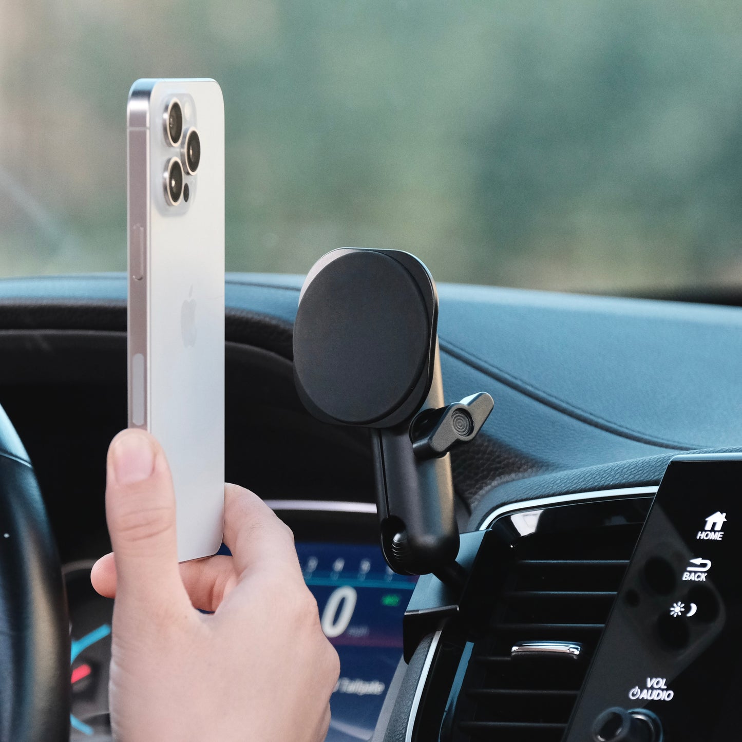 Image of Offroam MagSafe-compatible Phone Mount installed securely in Honda Ridgeline 2016-2025 | Passport 2019-2025 | Pilot 2016-2022. This premium phone mount installs easily without drilling or glue. High force magnets hold phone on any trail, road, or track. Perfect placement without blocking screens, driver view, or air flow. Fully adjustable positioning.