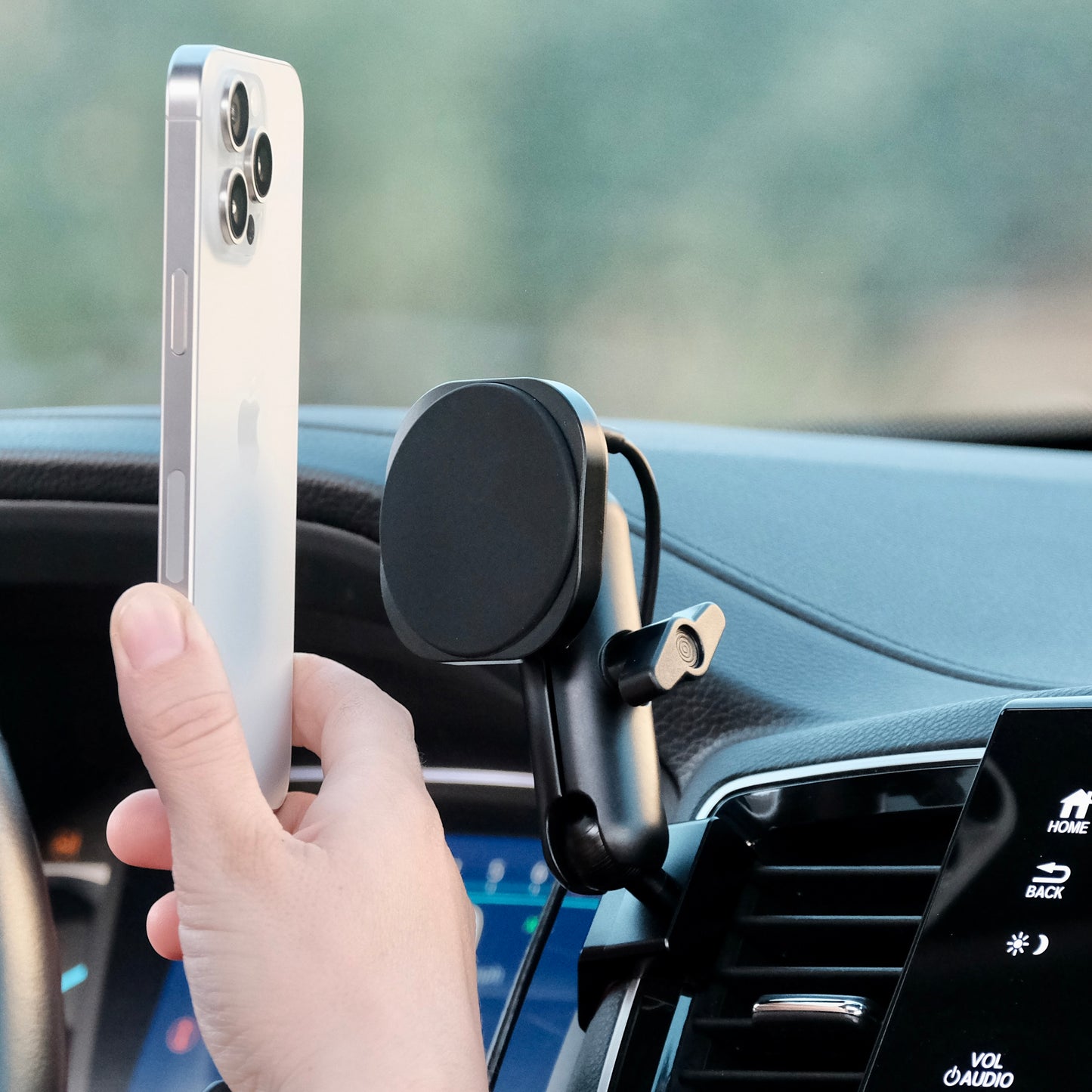 Image of Offroam MagSafe-compatible Phone Mount installed securely in Honda Ridgeline 2016-2025 | Passport 2019-2025 | Pilot 2016-2022. This premium phone mount installs easily without drilling or glue. High force magnets hold phone on any trail, road, or track. Perfect placement without blocking screens, driver view, or air flow. Fully adjustable positioning.