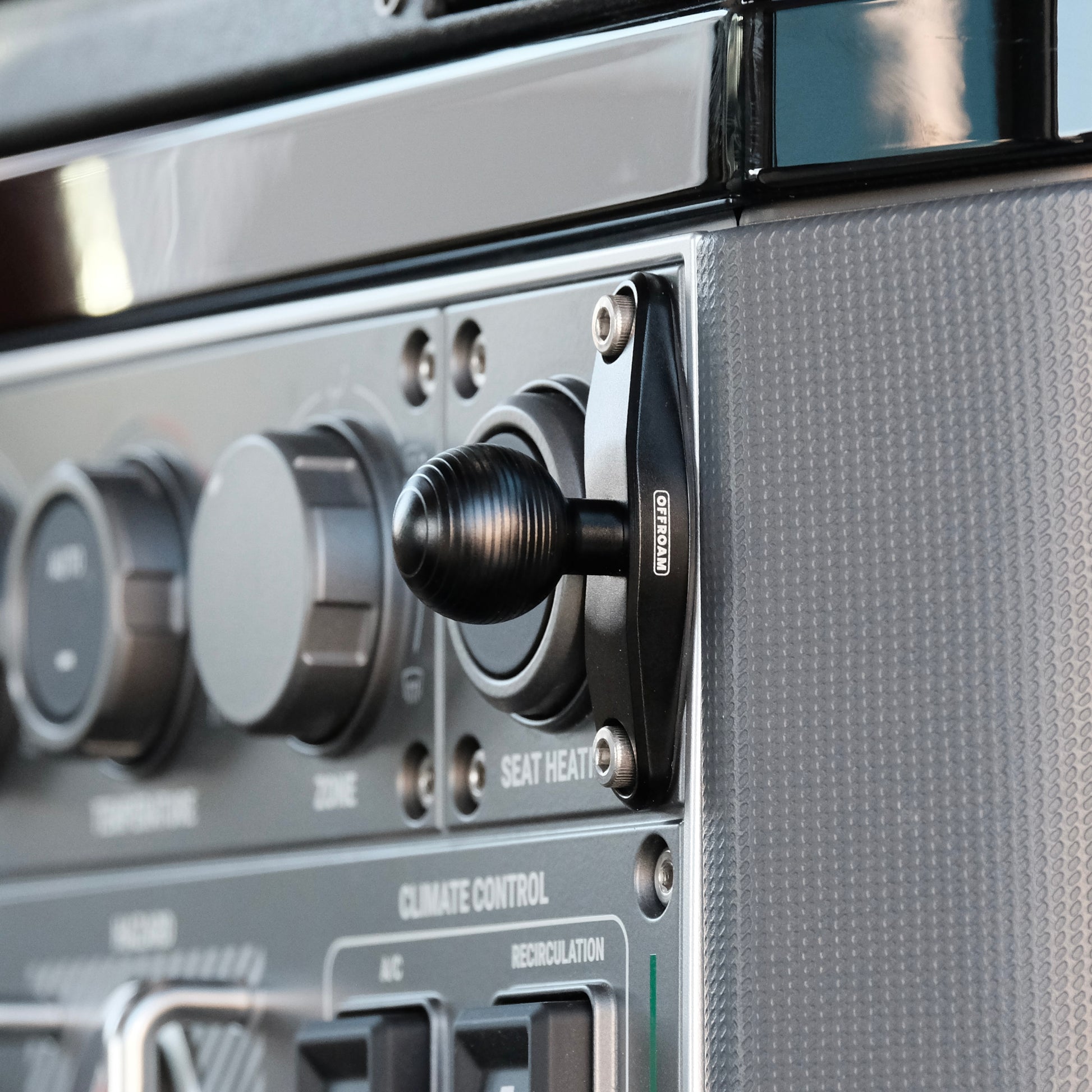 Image of Offroam Mounting Base installed securely in INEOS Grenadier 2022-2025. This premium all metal phone mounting base installs easily without drilling or glue. Perfect placement without blocking screens, driver view, or air flow.