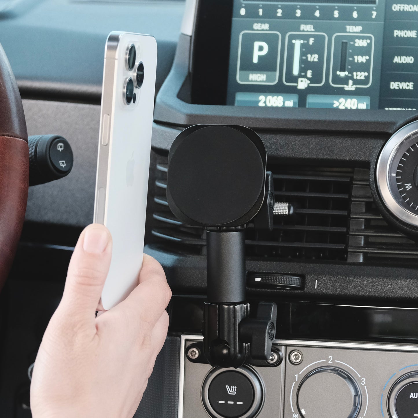 Image of Offroam MagSafe-compatible Phone Mount installed securely in INEOS Grenadier 2022-2025. This premium phone mount installs easily without drilling or glue. High force magnets hold phone on any trail, road, or track. Perfect placement without blocking screens, driver view, or air flow. Fully adjustable positioning.