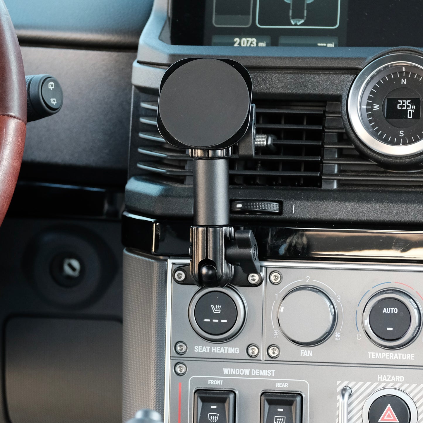 Image of Offroam MagSafe-compatible Phone Mount installed securely in INEOS Grenadier 2022-2025. This premium phone mount installs easily without drilling or glue. High force magnets hold phone on any trail, road, or track. Perfect placement without blocking screens, driver view, or air flow. Fully adjustable positioning.