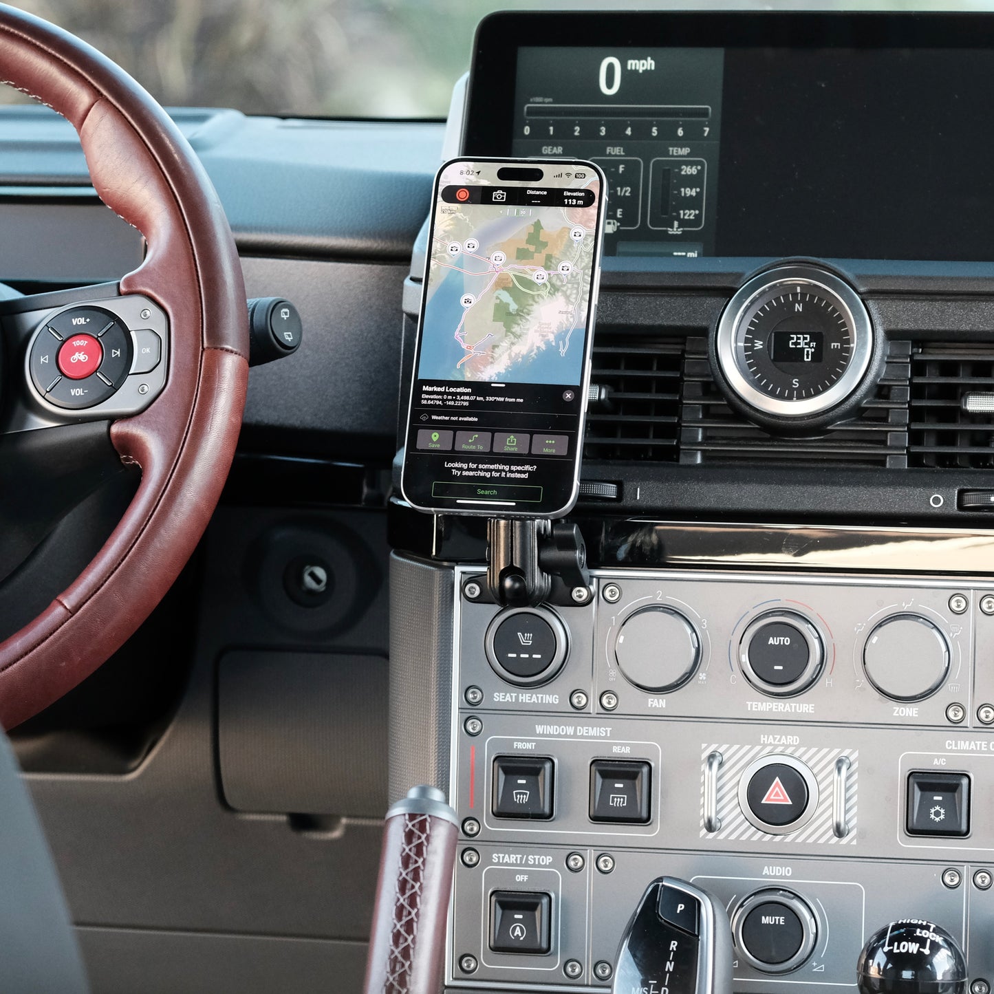 Image of Offroam MagSafe-compatible Phone Mount installed securely in INEOS Grenadier 2022-2025. This premium phone mount installs easily without drilling or glue. High force magnets hold phone on any trail, road, or track. Perfect placement without blocking screens, driver view, or air flow. Fully adjustable positioning.