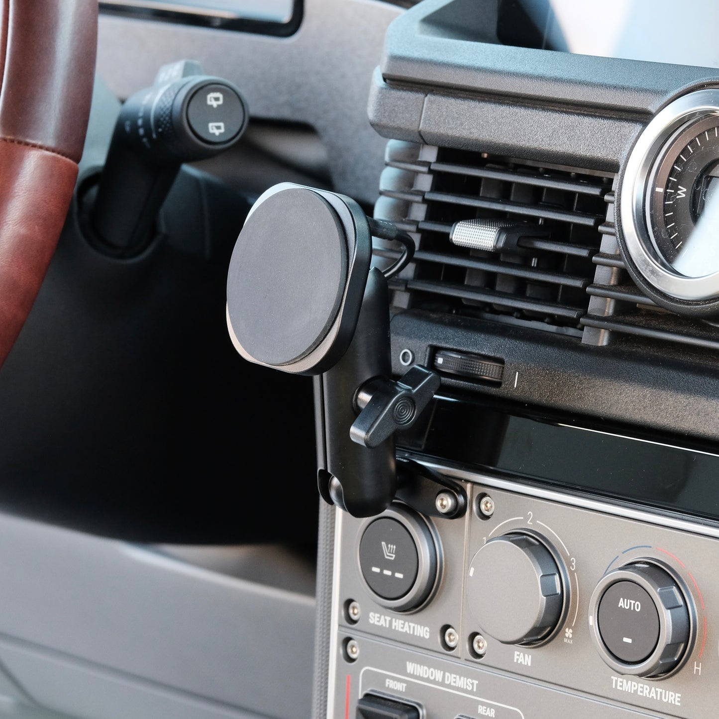 Image of Offroam MagSafe-compatible Phone Mount installed securely in INEOS Grenadier 2022-2025. This premium phone mount installs easily without drilling or glue. High force magnets hold phone on any trail, road, or track. Perfect placement without blocking screens, driver view, or air flow. Fully adjustable positioning.