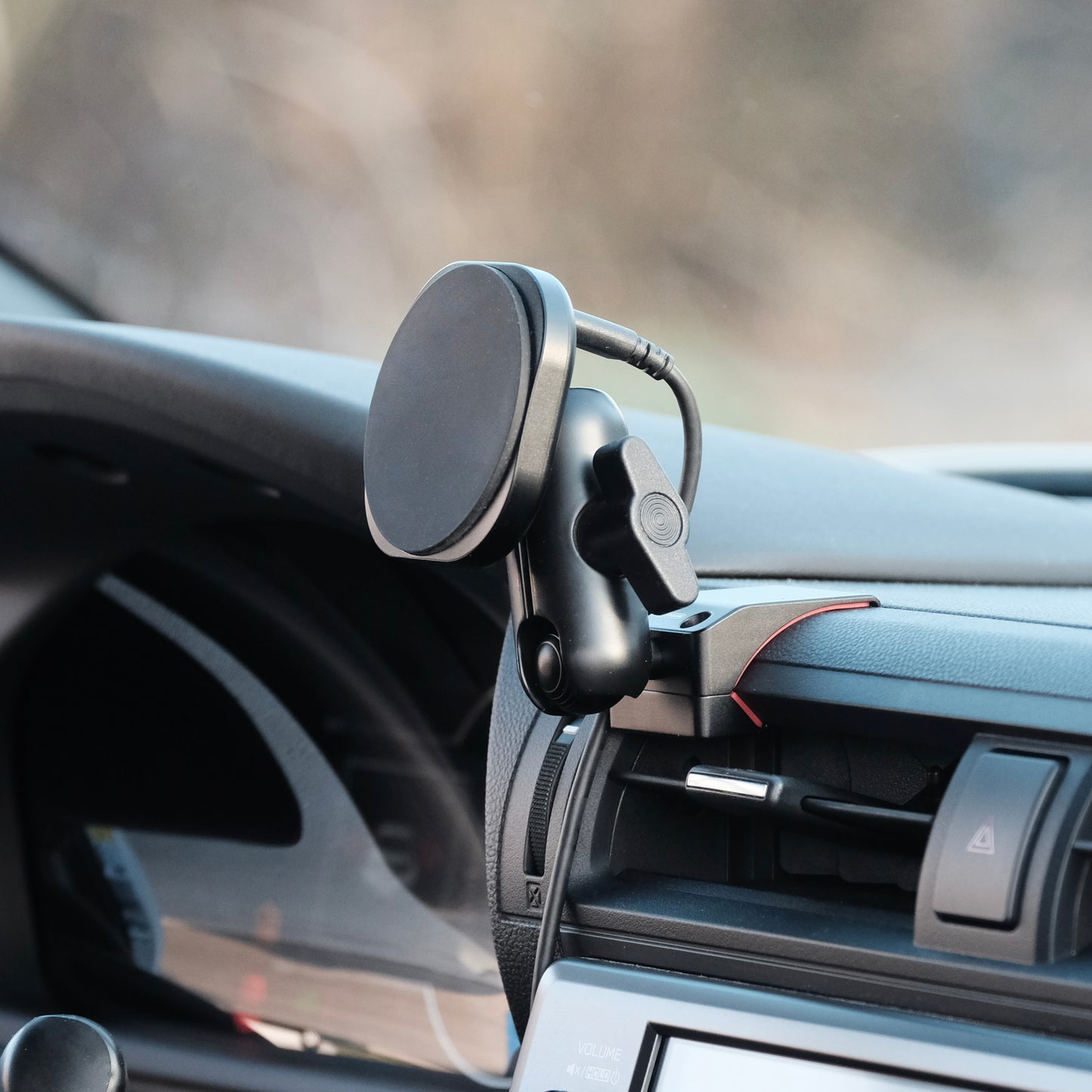 Image of Offroam MagSafe-compatible Phone Mount installed securely in Subaru BRZ 2022-2026 | Toyota GR86 2022-2026. This premium phone mount installs easily without drilling or glue. High force magnets hold phone on any trail, road, or track. Perfect placement without blocking screens, driver view, or air flow. Fully adjustable positioning.