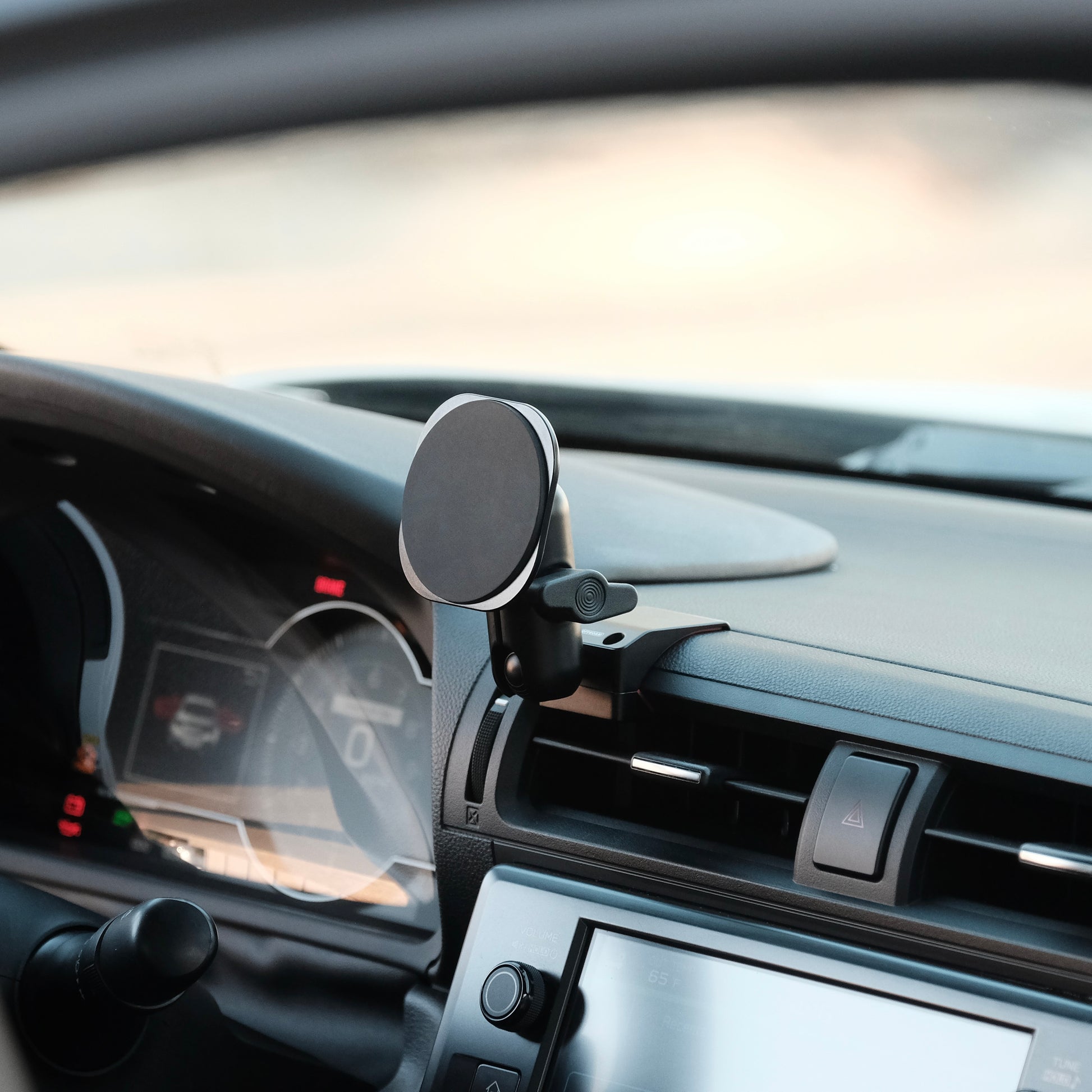 Image of Offroam MagSafe-compatible Phone Mount installed securely in Subaru BRZ 2022-2026 | Toyota GR86 2022-2026. This premium phone mount installs easily without drilling or glue. High force magnets hold phone on any trail, road, or track. Perfect placement without blocking screens, driver view, or air flow. Fully adjustable positioning.