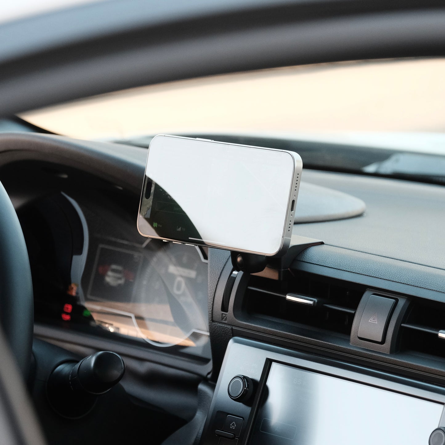 Image of Offroam MagSafe-compatible Phone Mount installed securely in Subaru BRZ 2022-2026 | Toyota GR86 2022-2026. This premium phone mount installs easily without drilling or glue. High force magnets hold phone on any trail, road, or track. Perfect placement without blocking screens, driver view, or air flow. Fully adjustable positioning.