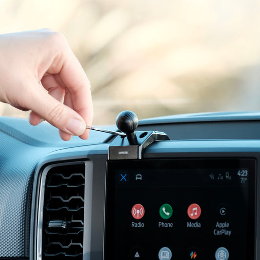 Image of Offroam Mounting Base installed securely in Ford Ranger 2024-2025. This premium all metal phone mounting base installs easily without drilling or glue. Perfect placement without blocking screens, driver view, or air flow.