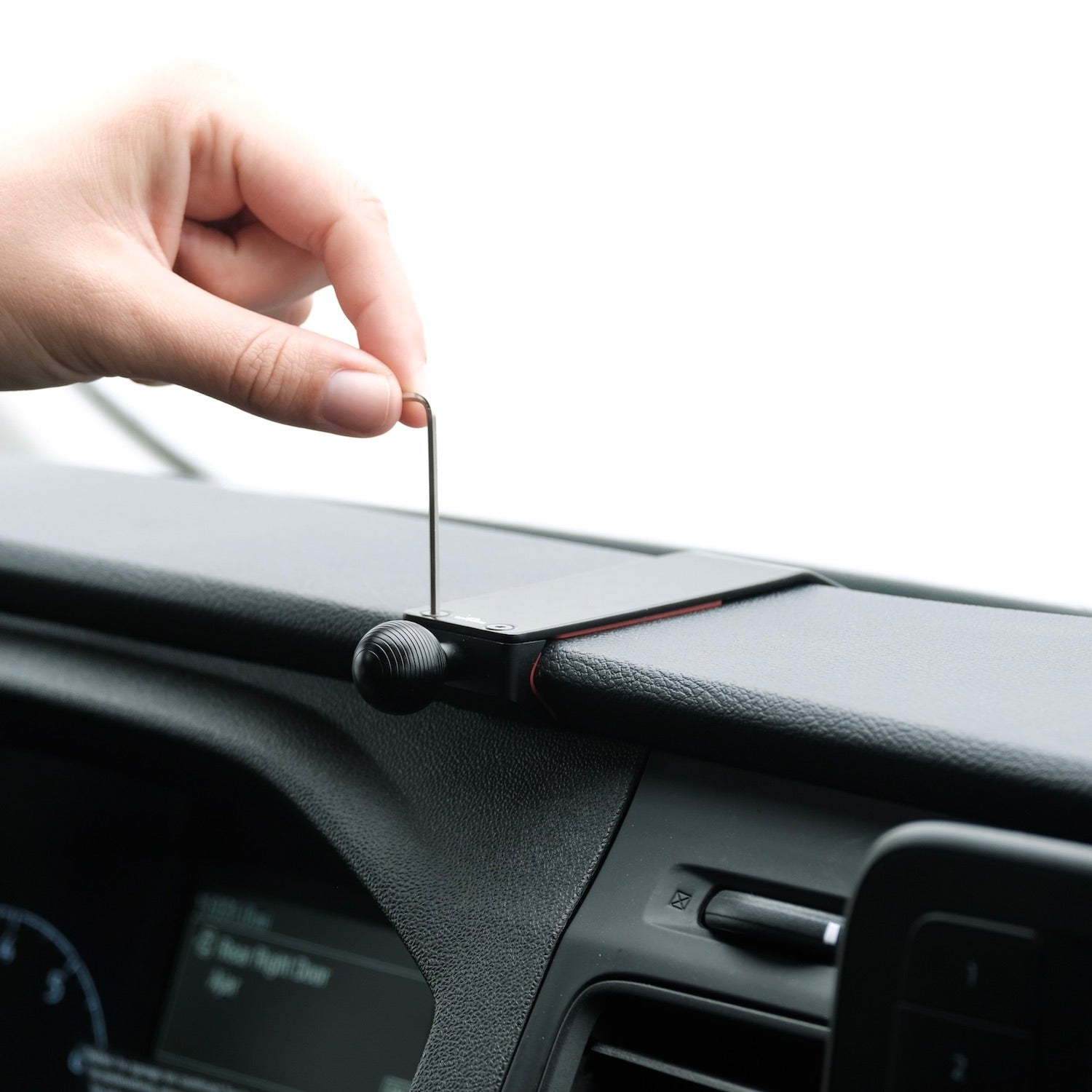 Image of Offroam Mounting Base installed securely in Ford Transit 2020-2025. This premium all metal phone mounting base installs easily without drilling or glue. Perfect placement without blocking screens, driver view, or air flow.