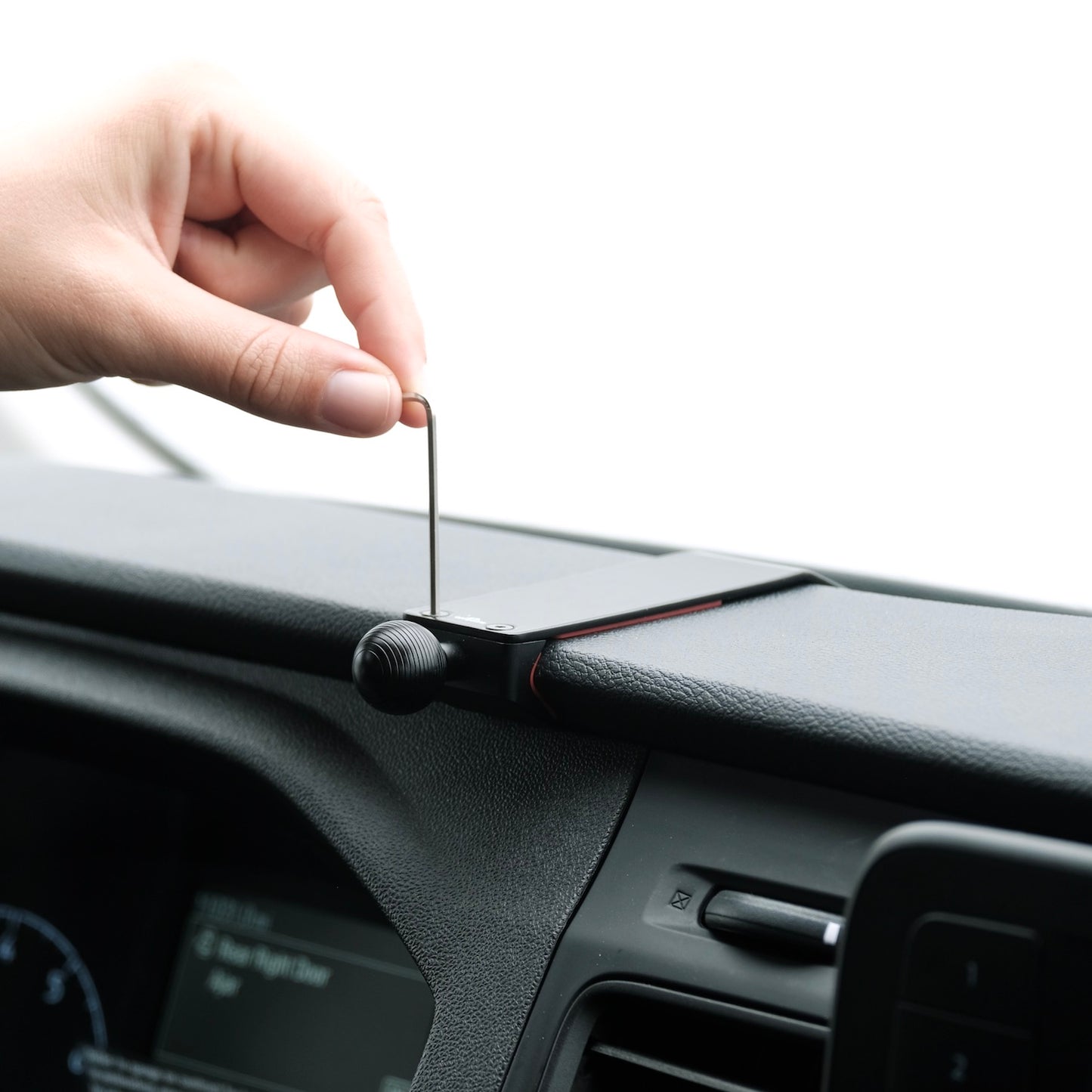 Image of Offroam Mounting Base installed securely in Ford Transit 2020-2025. This premium all metal phone mounting base installs easily without drilling or glue. Perfect placement without blocking screens, driver view, or air flow.