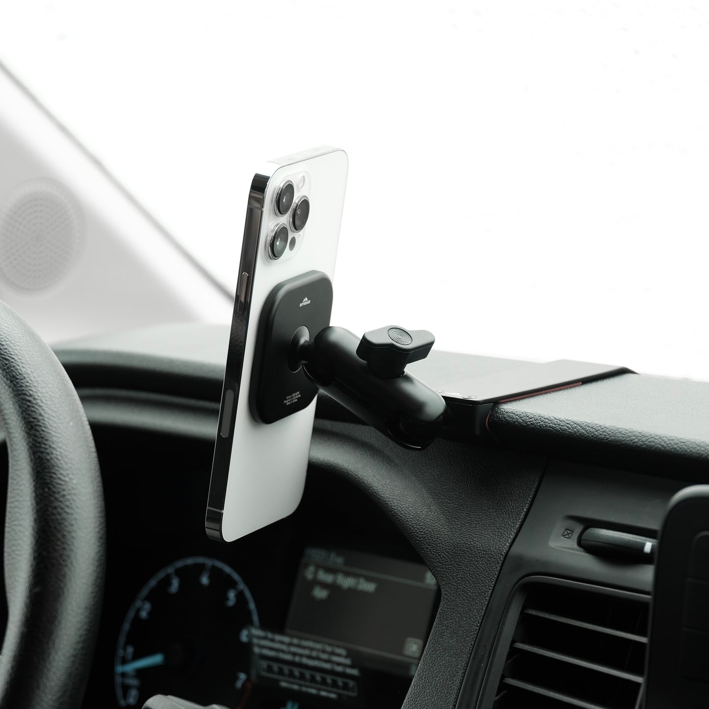 Image of Offroam MagSafe-compatible Phone Mount installed securely in Ford Transit 2020-2025. This premium phone mount installs easily without drilling or glue. High force magnets hold phone on any trail, road, or track. Perfect placement without blocking screens, driver view, or air flow. Fully adjustable positioning.