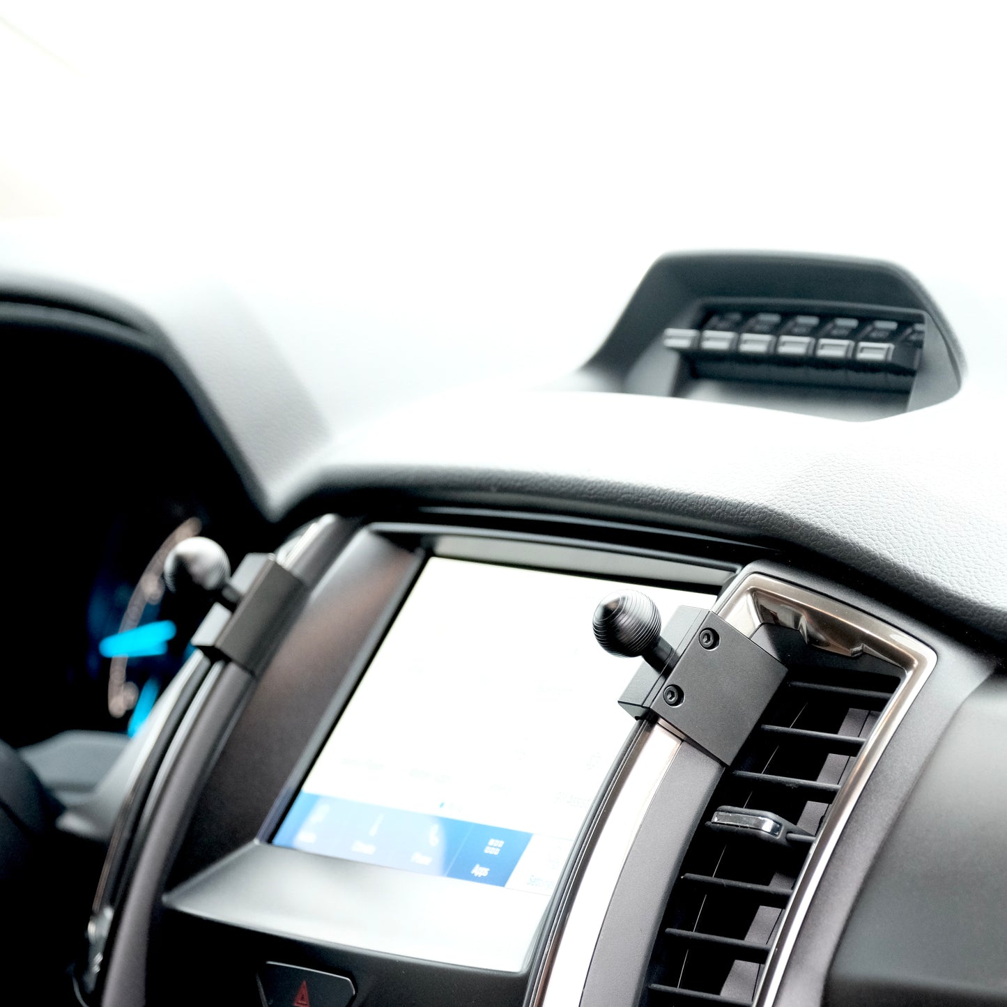 Image of Offroam Mounting Base installed securely in Ford Ranger 2019-2023. This premium all metal phone mounting base installs easily without drilling or glue. Perfect placement without blocking screens, driver view, or air flow.