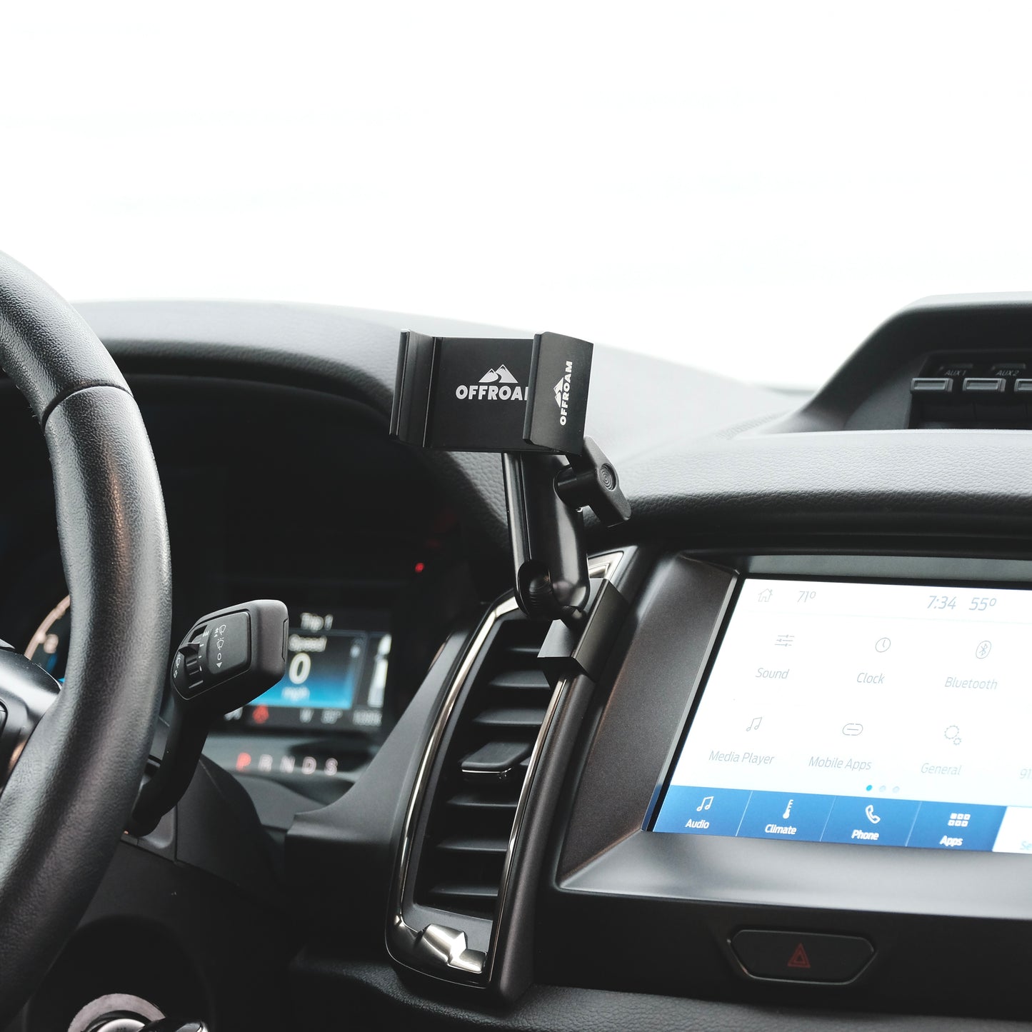 Image of Offroam Phone Mount installed securely in Ford Ranger 2019-2023. This premium phone mount installs easily without drilling or glue. Spring loaded Universal holder for use with any phone. Perfect placement without blocking screens, driver view, or air flow. Fully adjustable positioning.