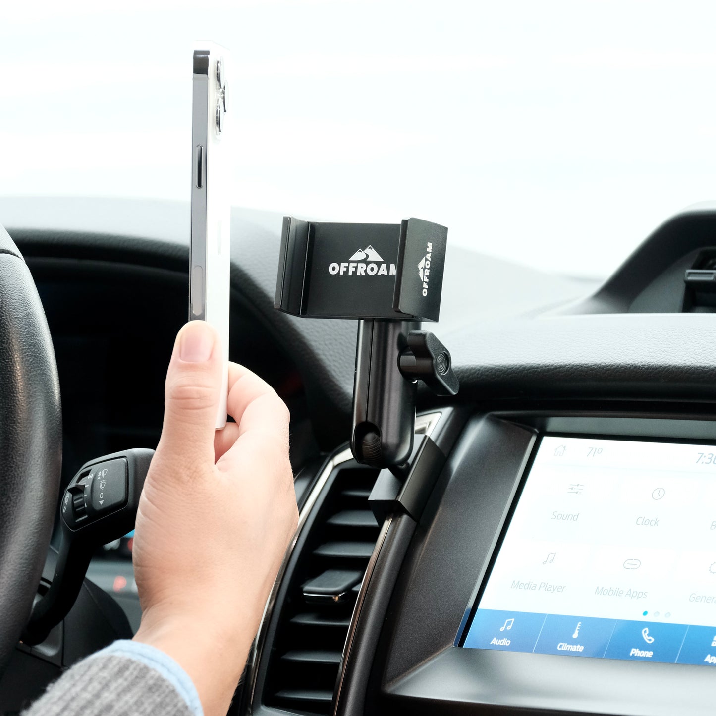Image of Offroam Phone Mount installed securely in Ford Ranger 2019-2023. This premium phone mount installs easily without drilling or glue. Spring loaded Universal holder for use with any phone. Perfect placement without blocking screens, driver view, or air flow. Fully adjustable positioning.